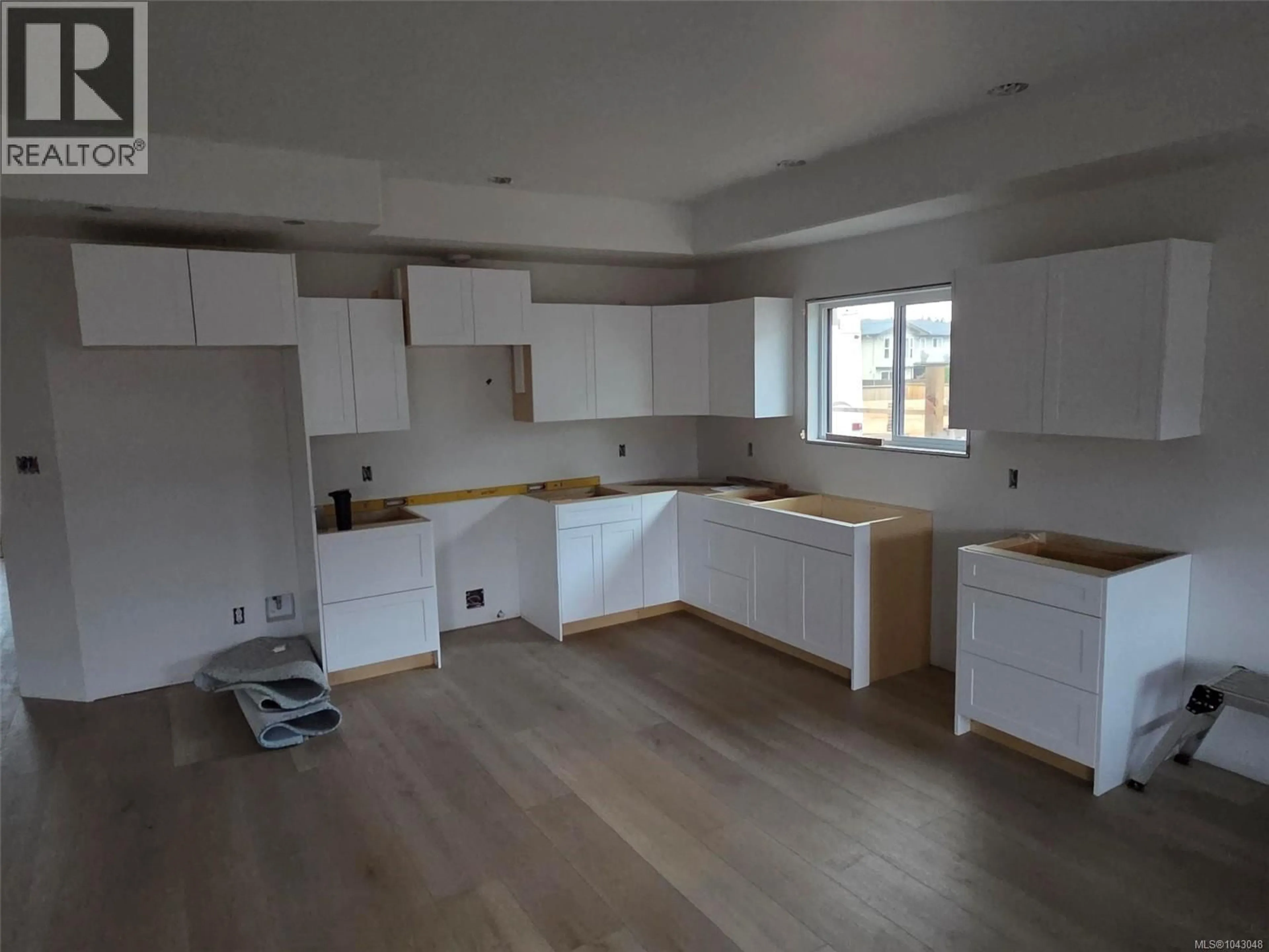 Open concept kitchen, wood/laminate floor for 5255 TEBO AVENUE, Port Alberni British Columbia V9Y6A2