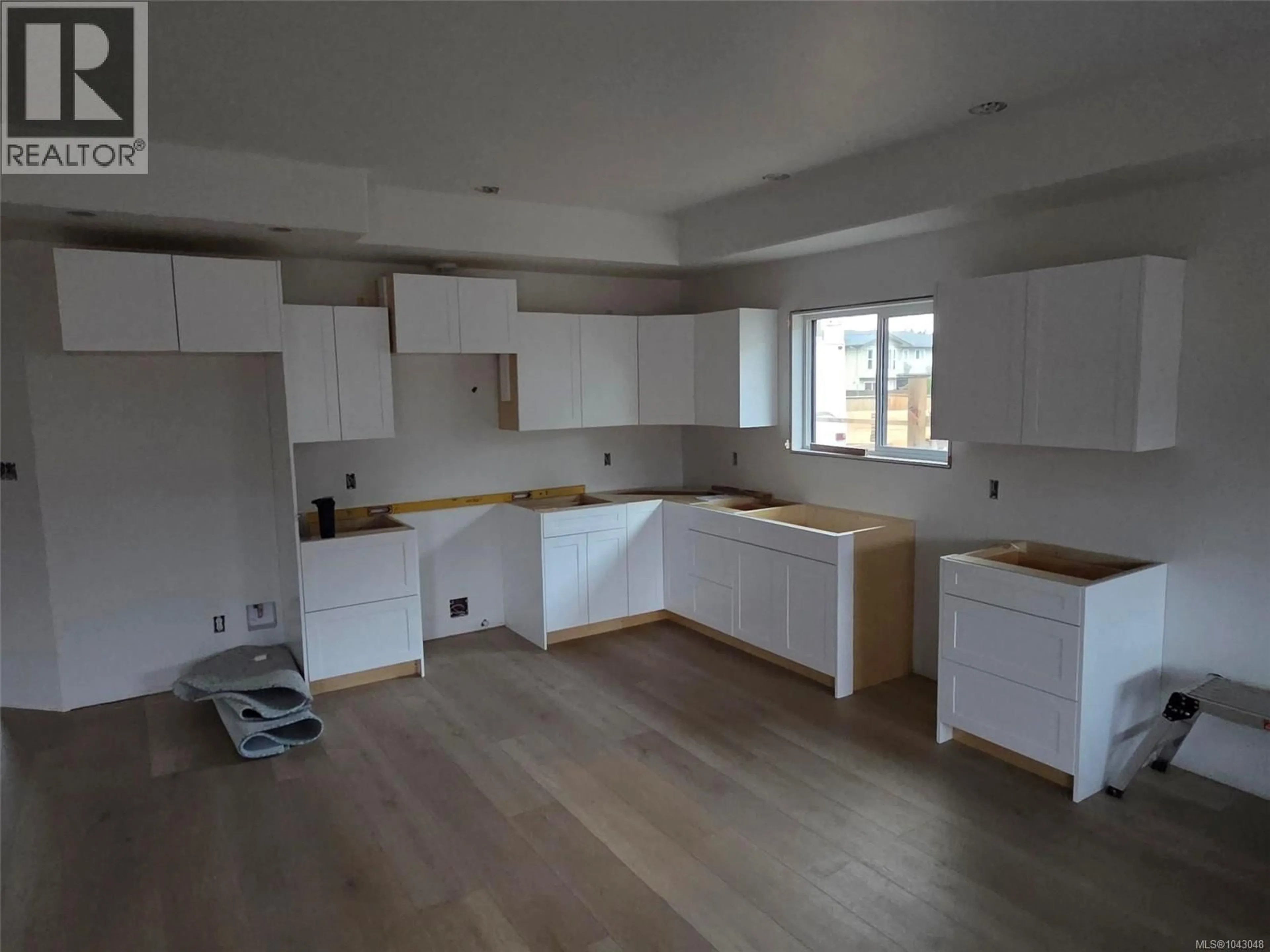 Open concept kitchen, wood/laminate floor for 5255 TEBO AVENUE, Port Alberni British Columbia V9Y6A2
