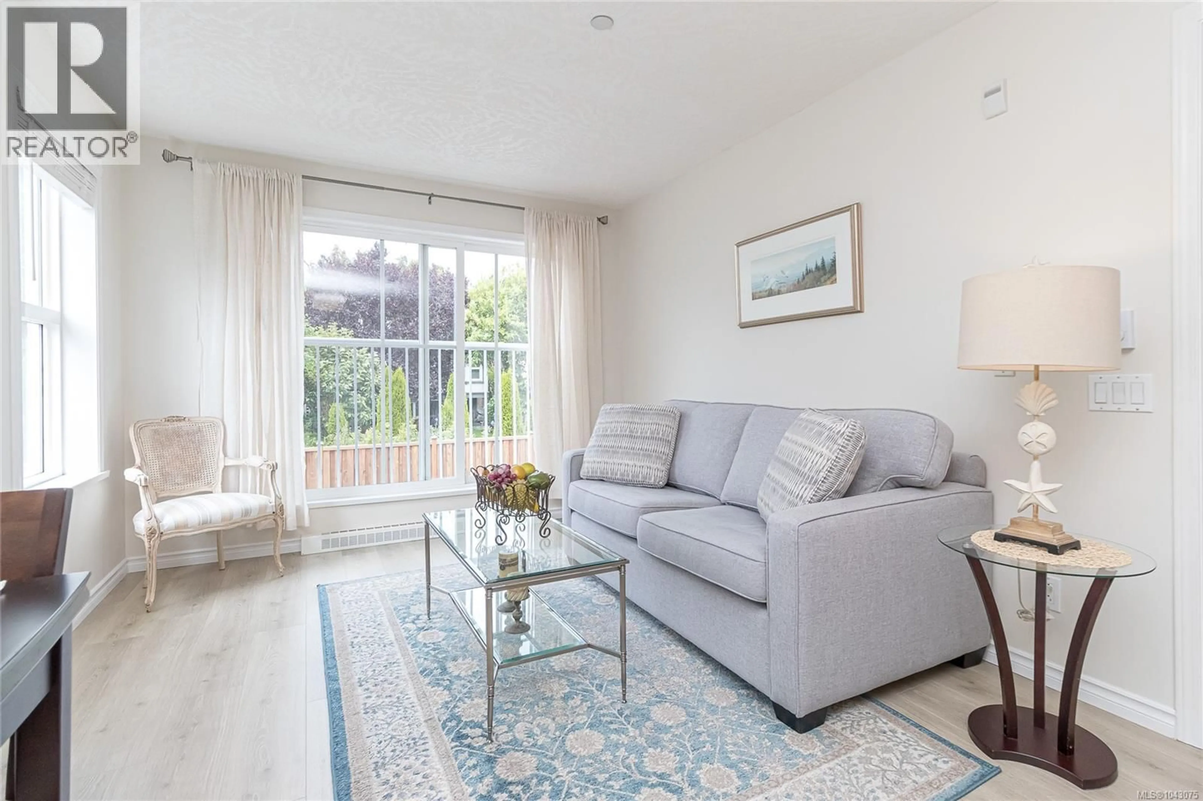 Living room with furniture, wood/laminate floor for 309 - 1070 SOUTHGATE STREET, Victoria British Columbia V8V2Z2
