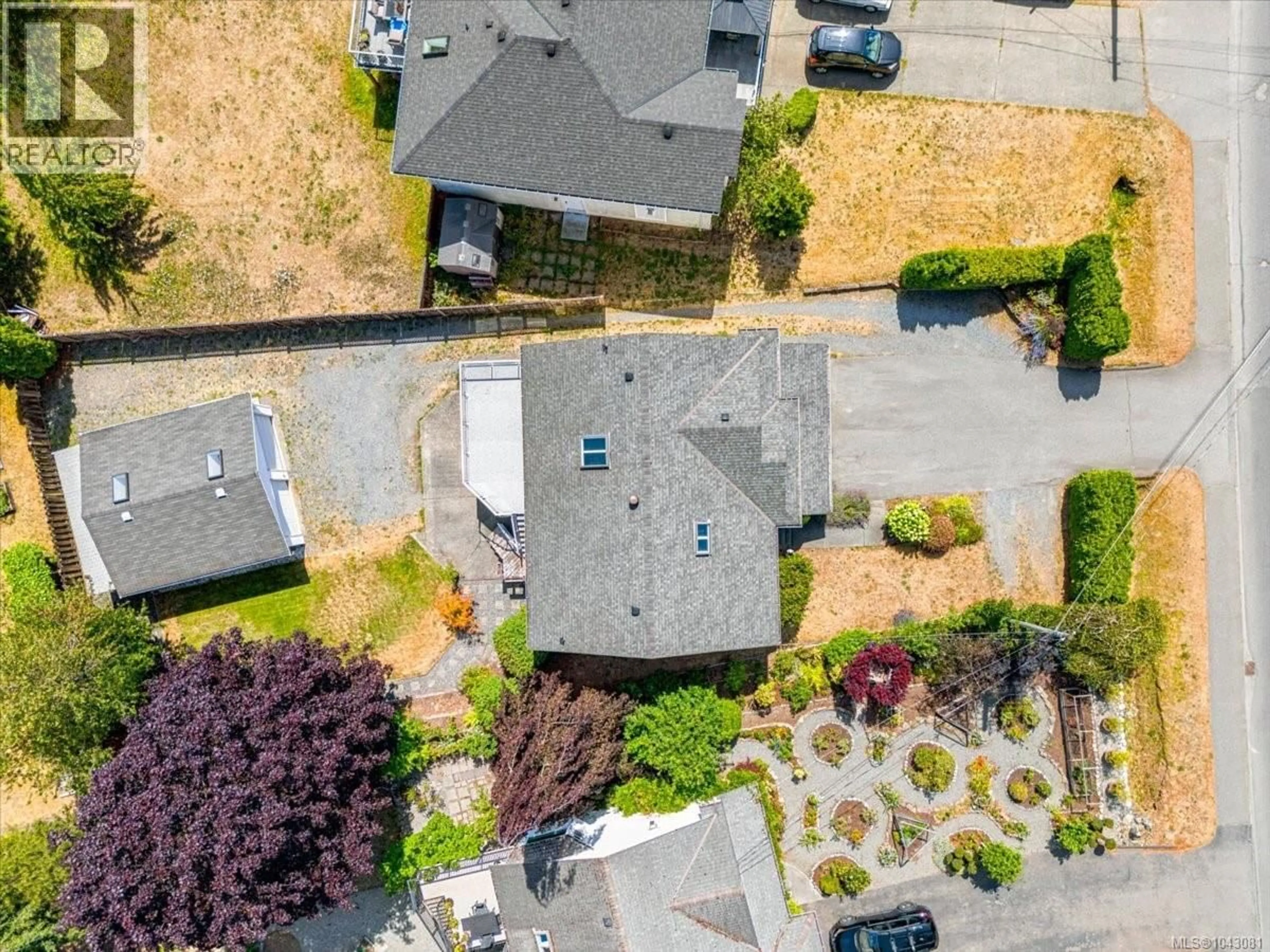 A pic from outside/outdoor area/front of a property/back of a property/a pic from drone, street for 2712 LABIEUX ROAD, Nanaimo British Columbia V9T3N6