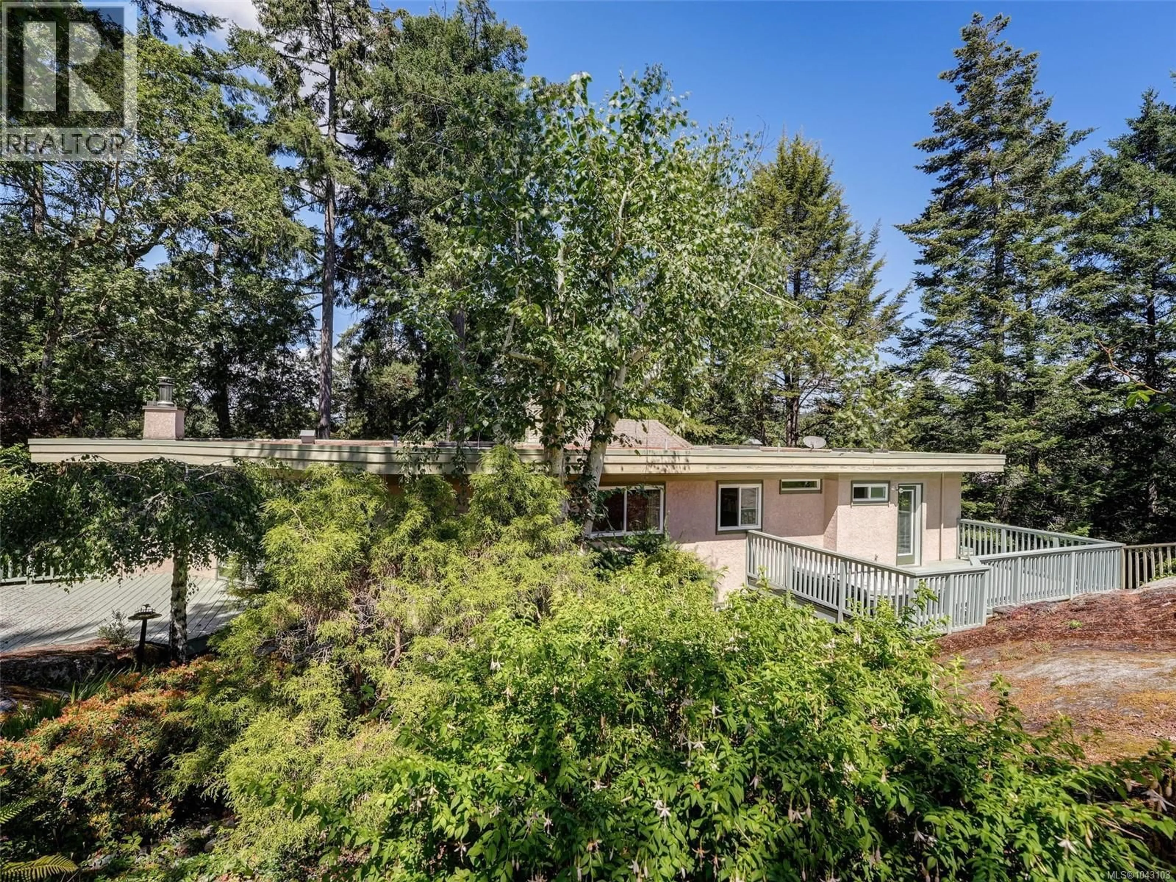A pic from outside/outdoor area/front of a property/back of a property/a pic from drone, forest/trees view for 1055 THISTLEWOOD DRIVE, Saanich British Columbia V8X4V7