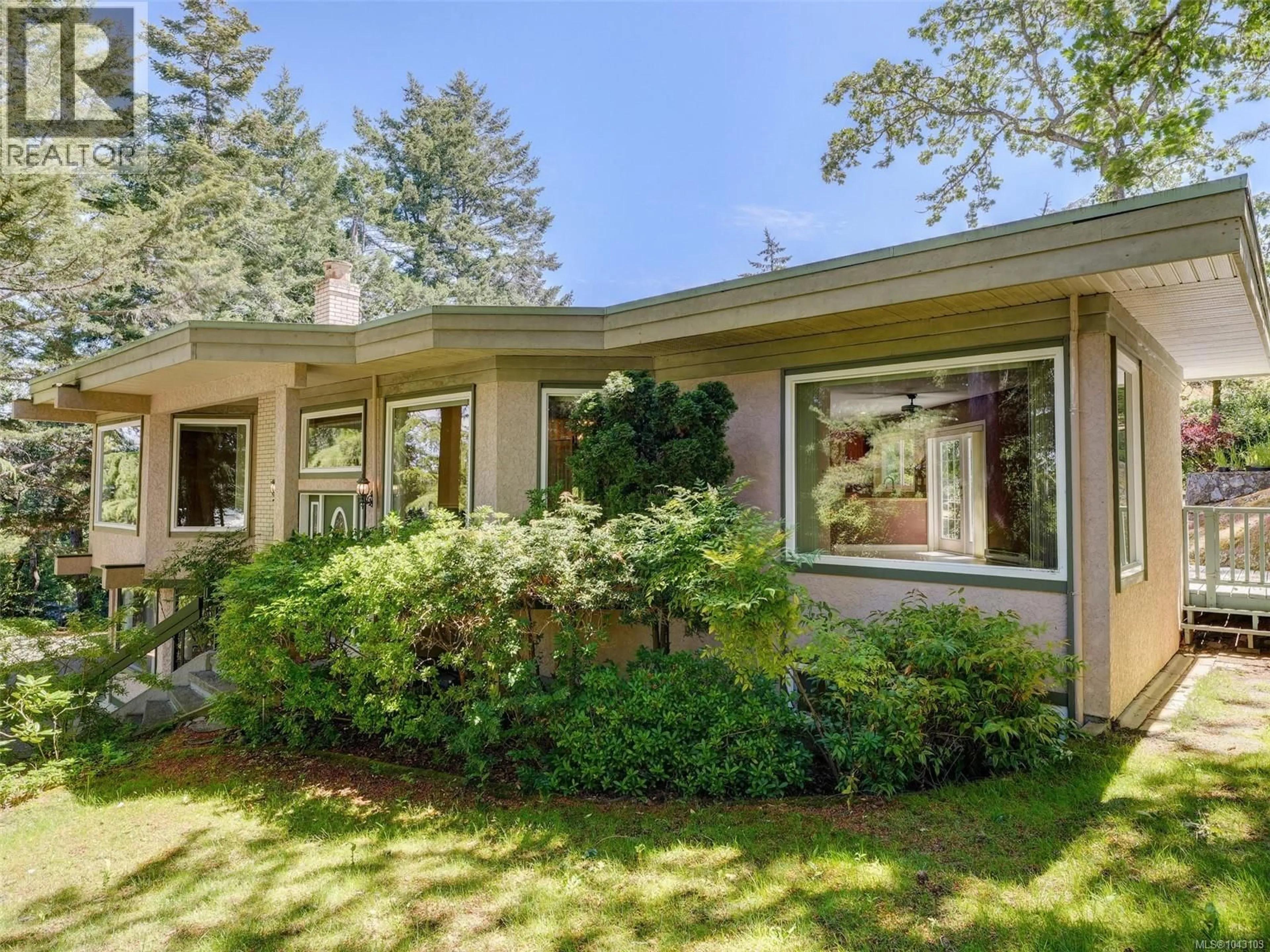 Home with brick exterior material, unknown for 1055 THISTLEWOOD DRIVE, Saanich British Columbia V8X4V7