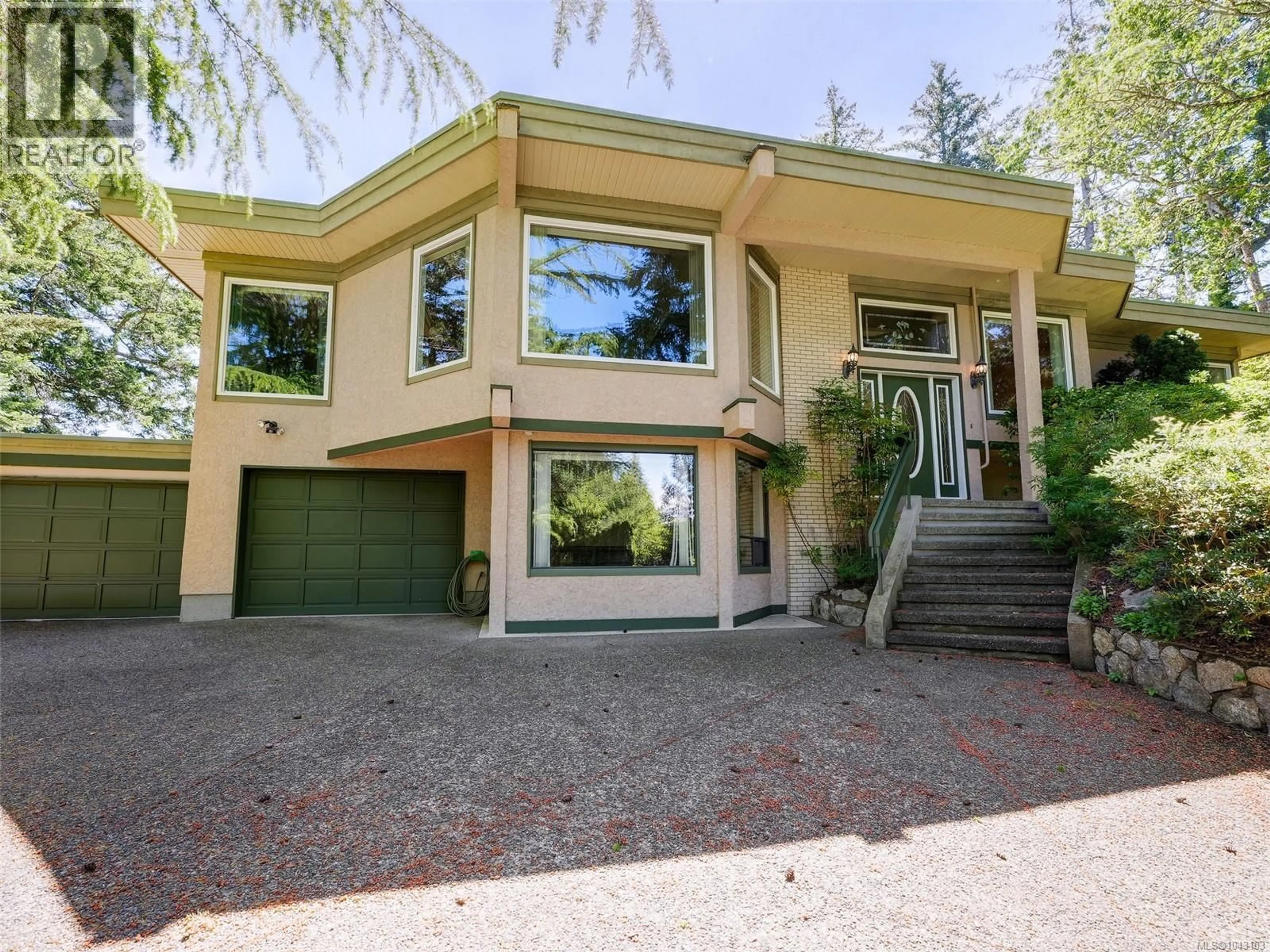 Home with vinyl exterior material, street for 1055 THISTLEWOOD DRIVE, Saanich British Columbia V8X4V7