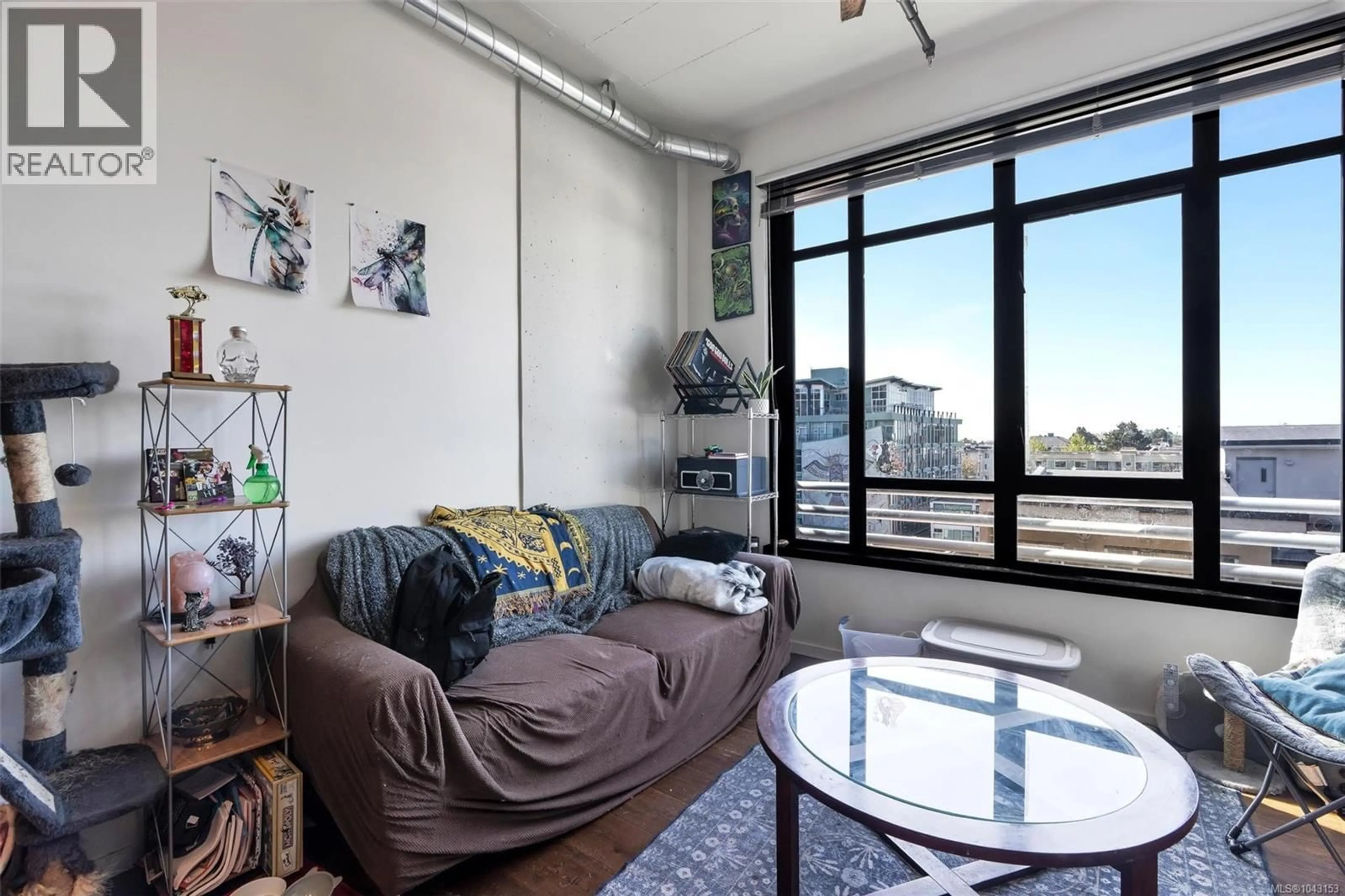 Living room with furniture, cement floor for 610 - 1029 VIEW STREET, Victoria British Columbia V8V0C9