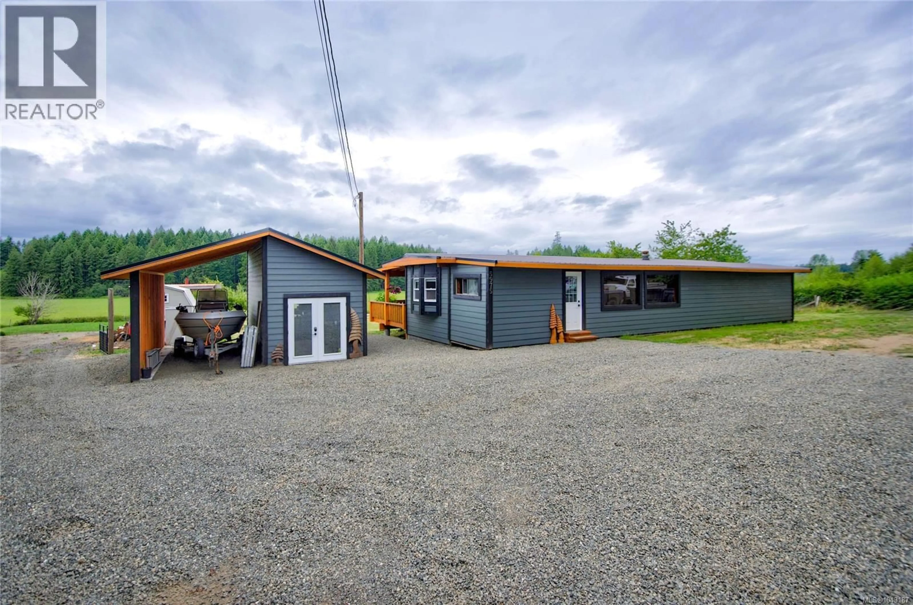 A pic from outside/outdoor area/front of a property/back of a property/a pic from drone, building for 5975 ISLAND HIGHWAY NORTH, Merville British Columbia V9J1T4