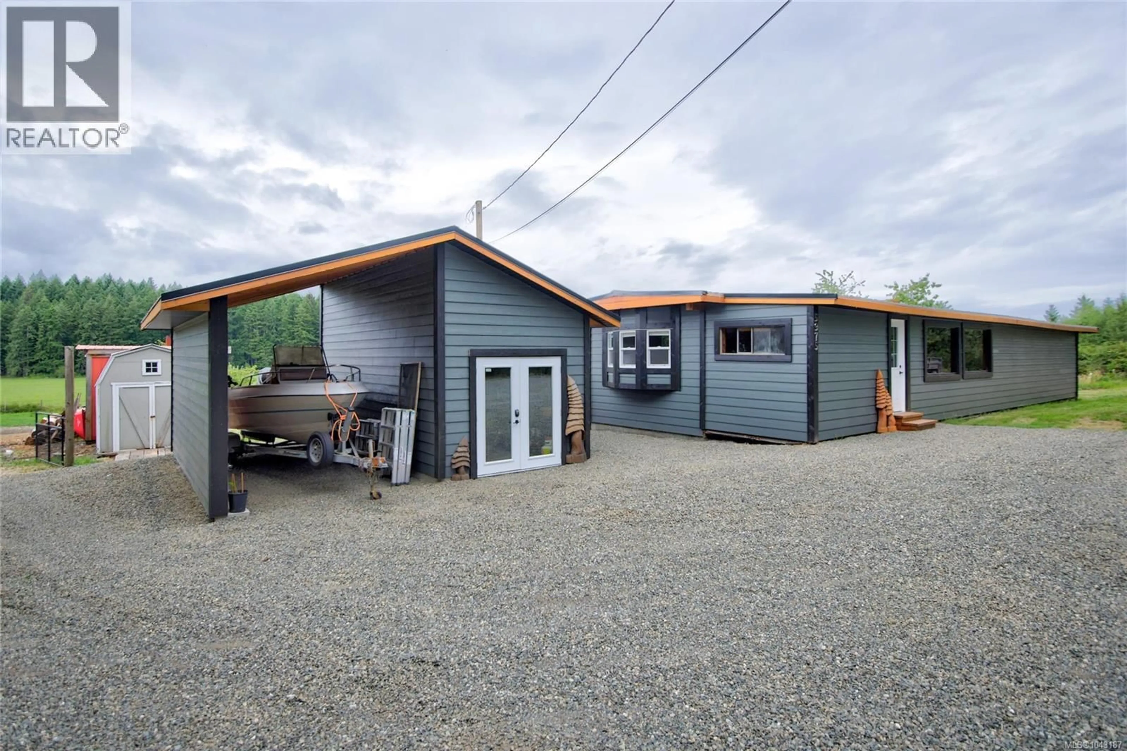 A pic from outside/outdoor area/front of a property/back of a property/a pic from drone, street for 5975 ISLAND HIGHWAY NORTH, Merville British Columbia V9J1T4
