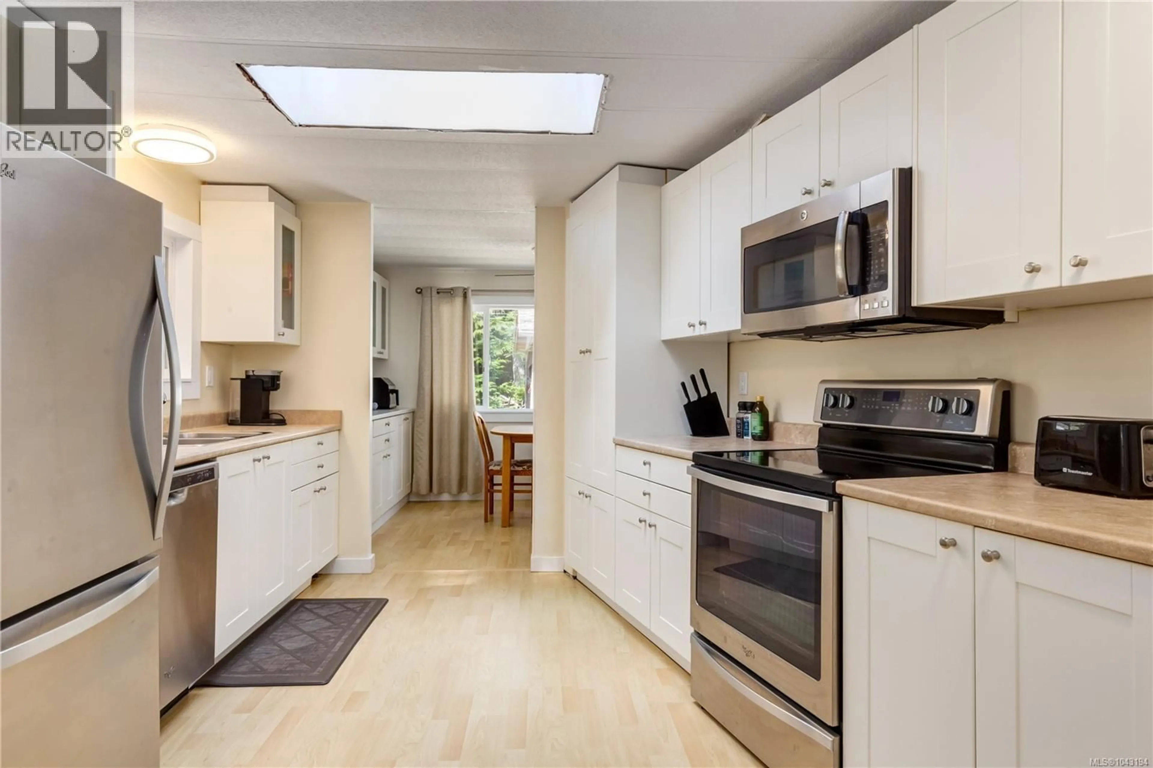 Standard kitchen, ceramic/tile floor for 4559 MAPLE GUARD DRIVE, Bowser British Columbia V0R1G0