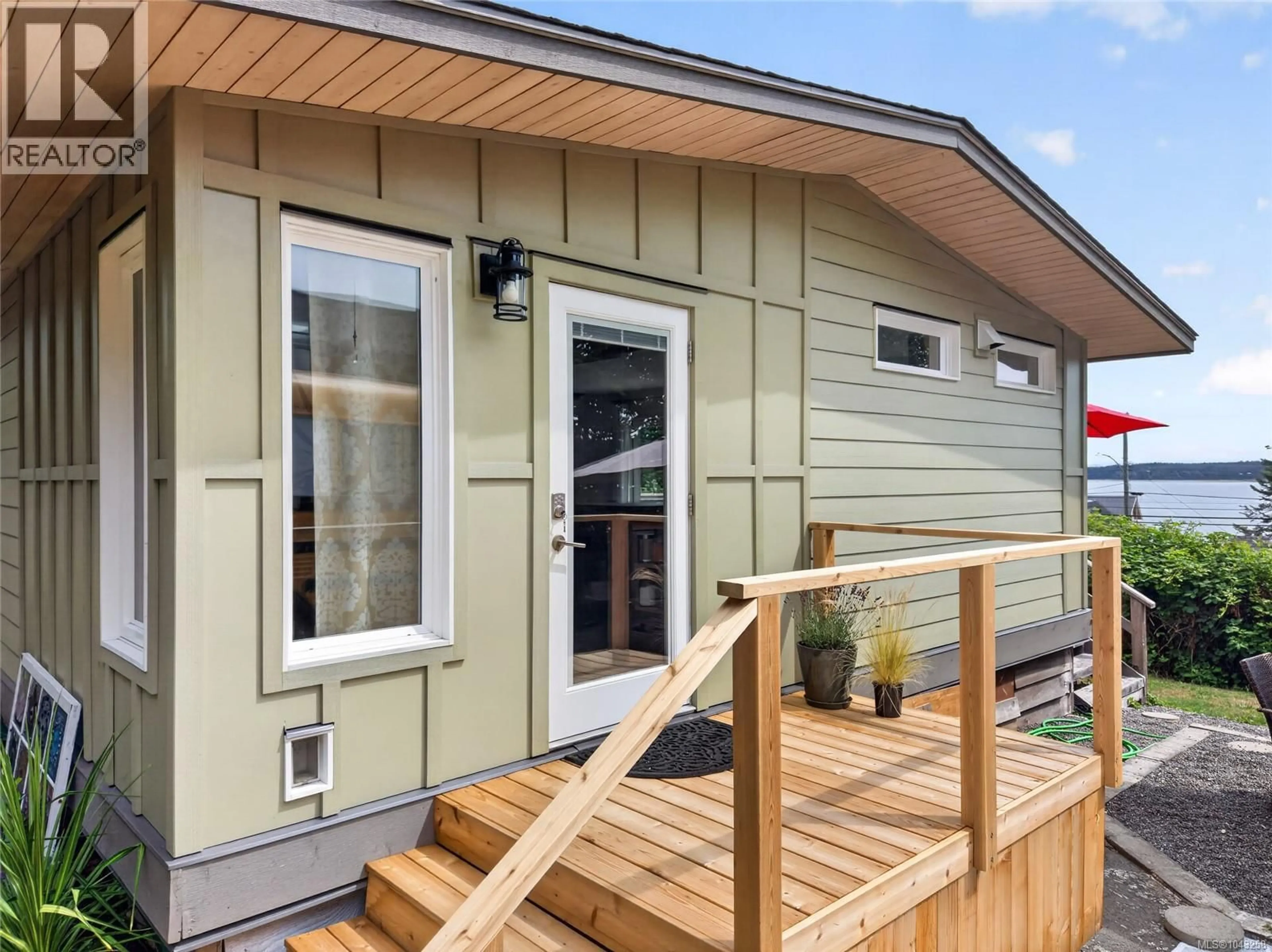 Home with vinyl exterior material, street for 5674 MARKET STREET, Union Bay British Columbia V0R3B0