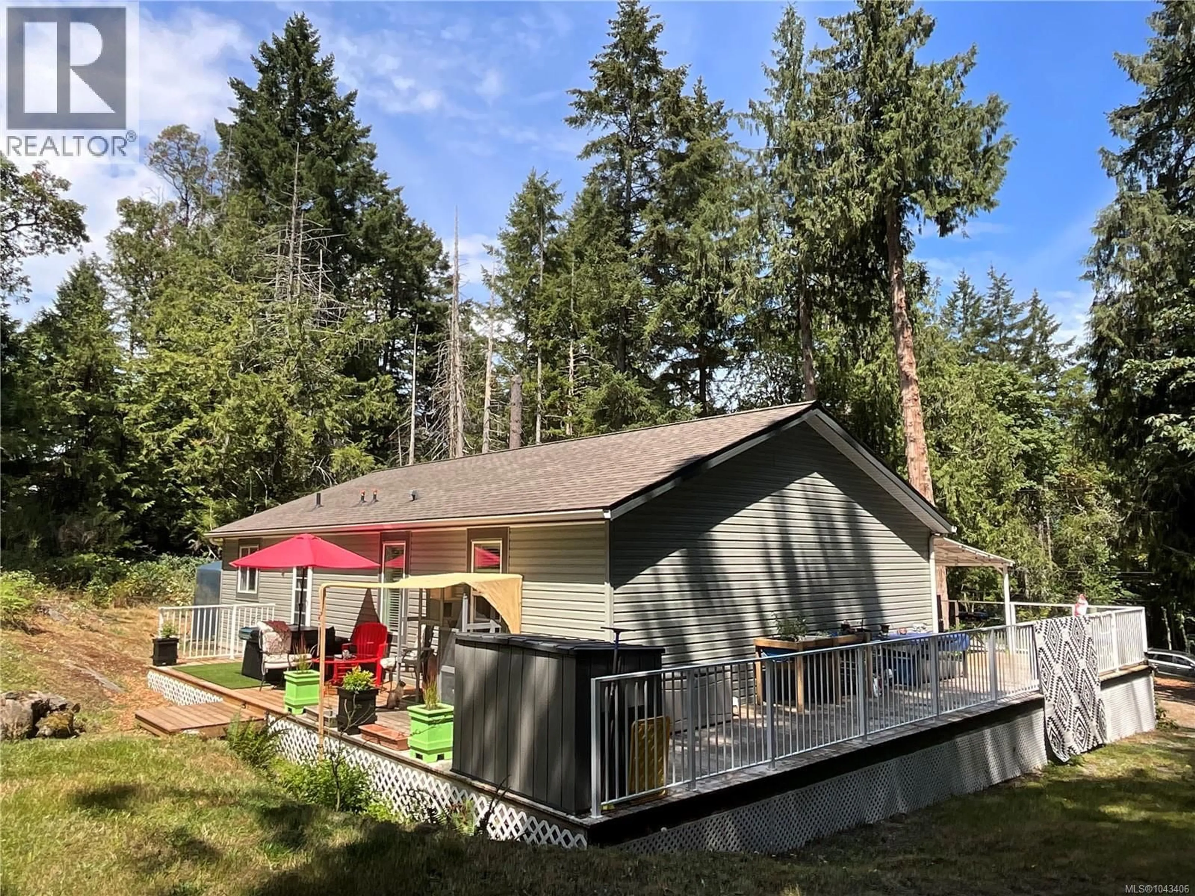 Home with vinyl exterior material, forest/trees view for 157 EASTHOM ROAD, Gabriola Island British Columbia V0R1X2