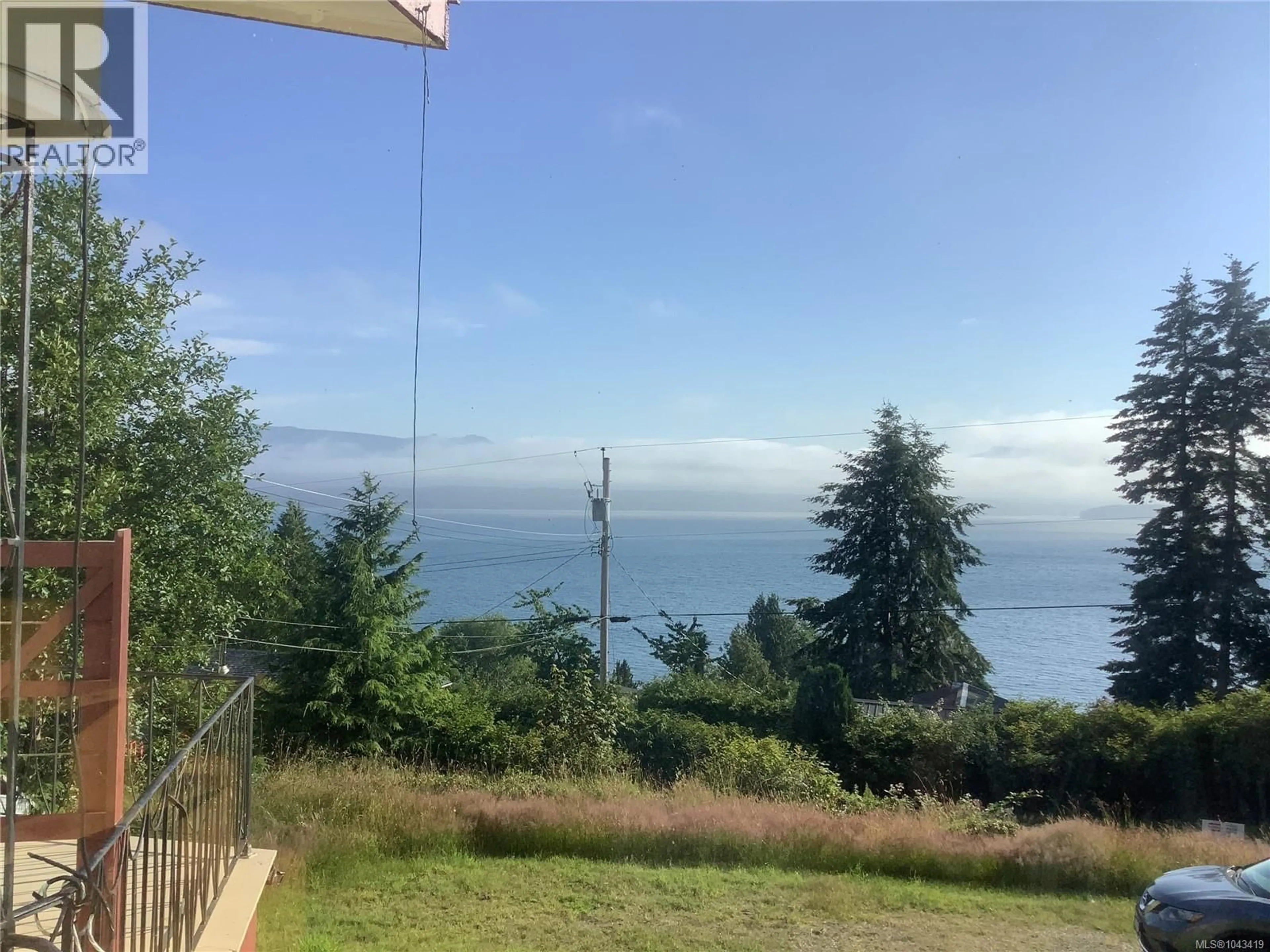 A pic from outside/outdoor area/front of a property/back of a property/a pic from drone, water/lake/river/ocean view for 395 2ND STREET, Sointula British Columbia V0N3E0
