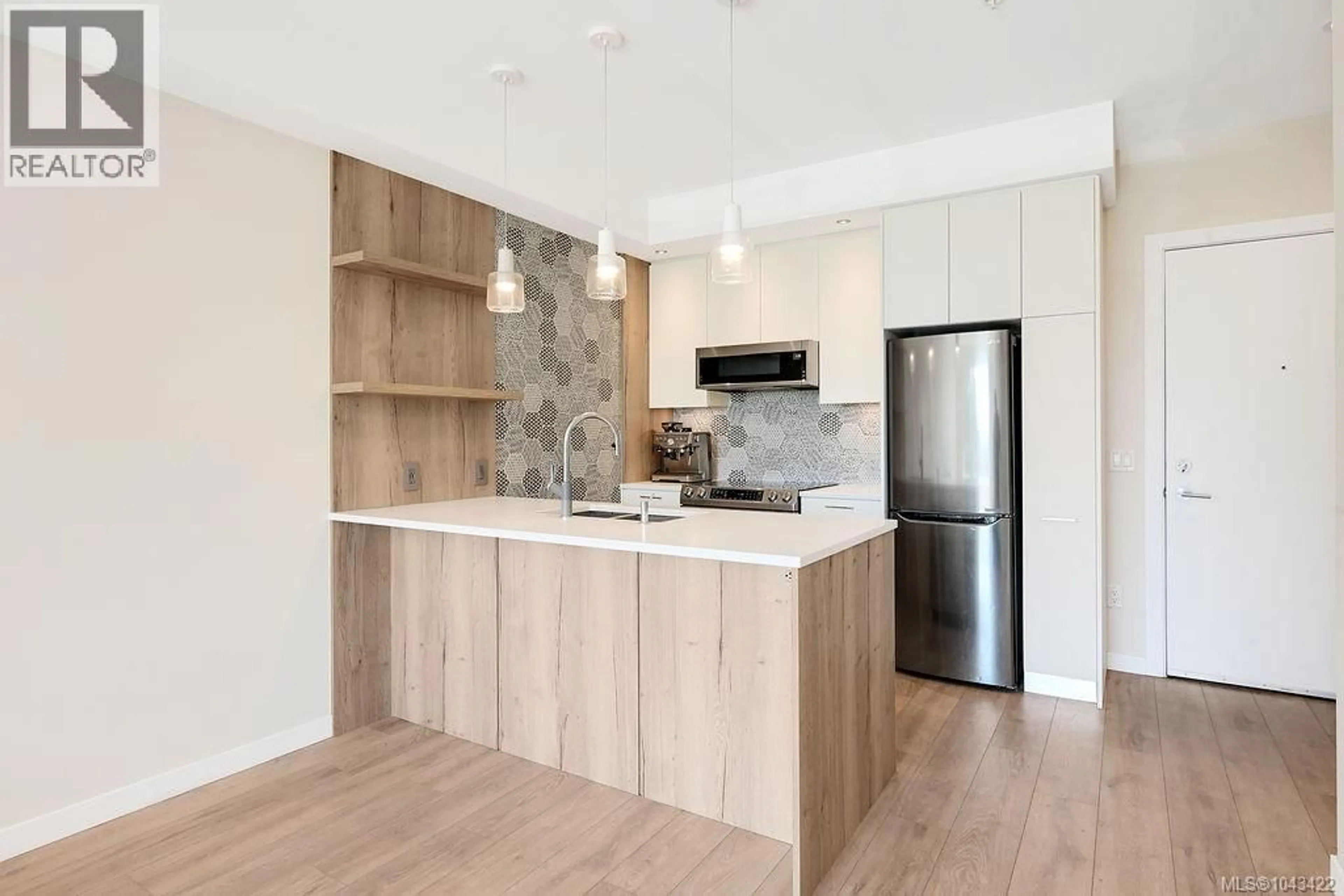 Open concept kitchen, wood/laminate floor for 303 - 1588 NORTH DAIRY ROAD, Saanich British Columbia V9T0E1
