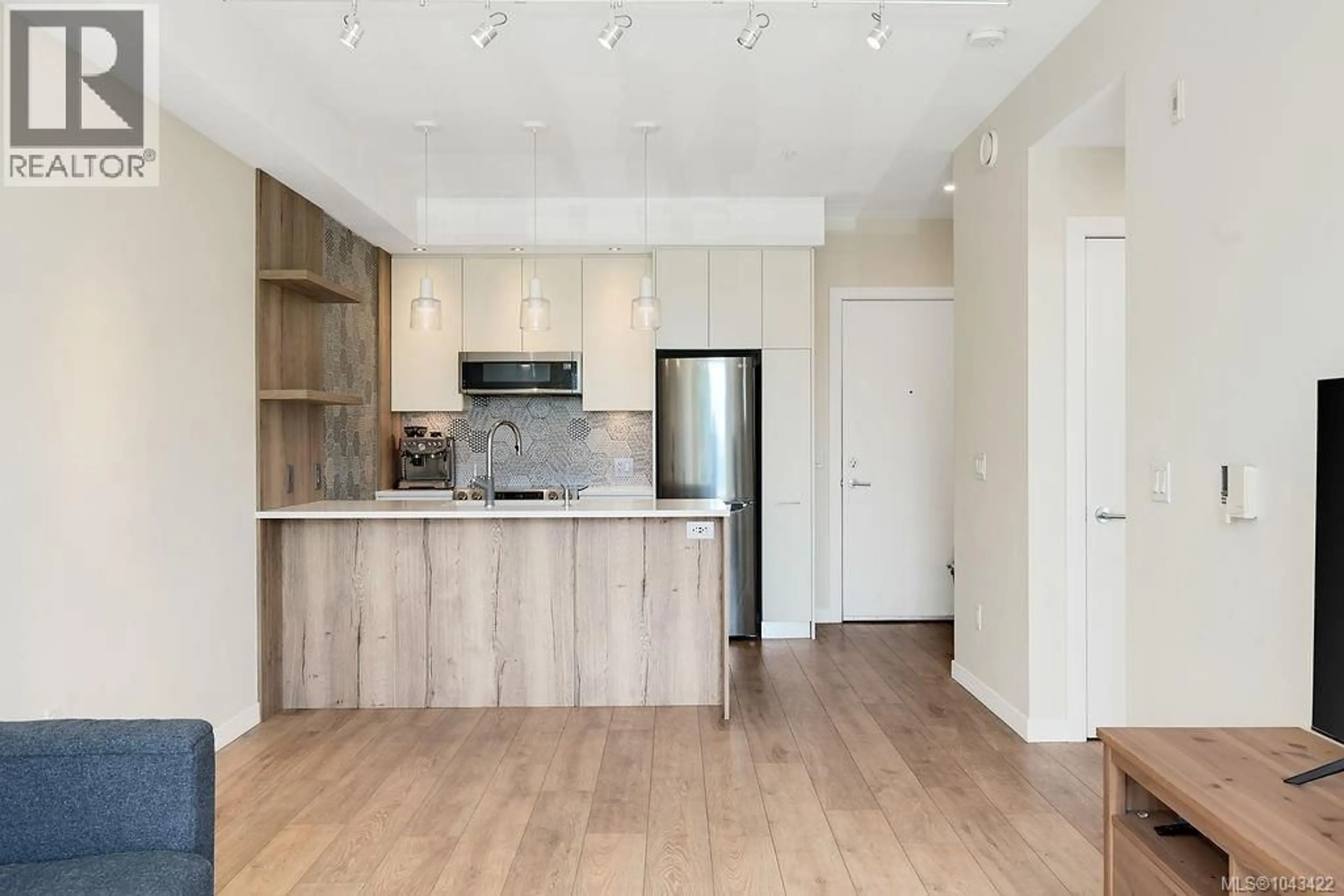 Open concept kitchen, wood/laminate floor for 303 - 1588 NORTH DAIRY ROAD, Saanich British Columbia V9T0E1