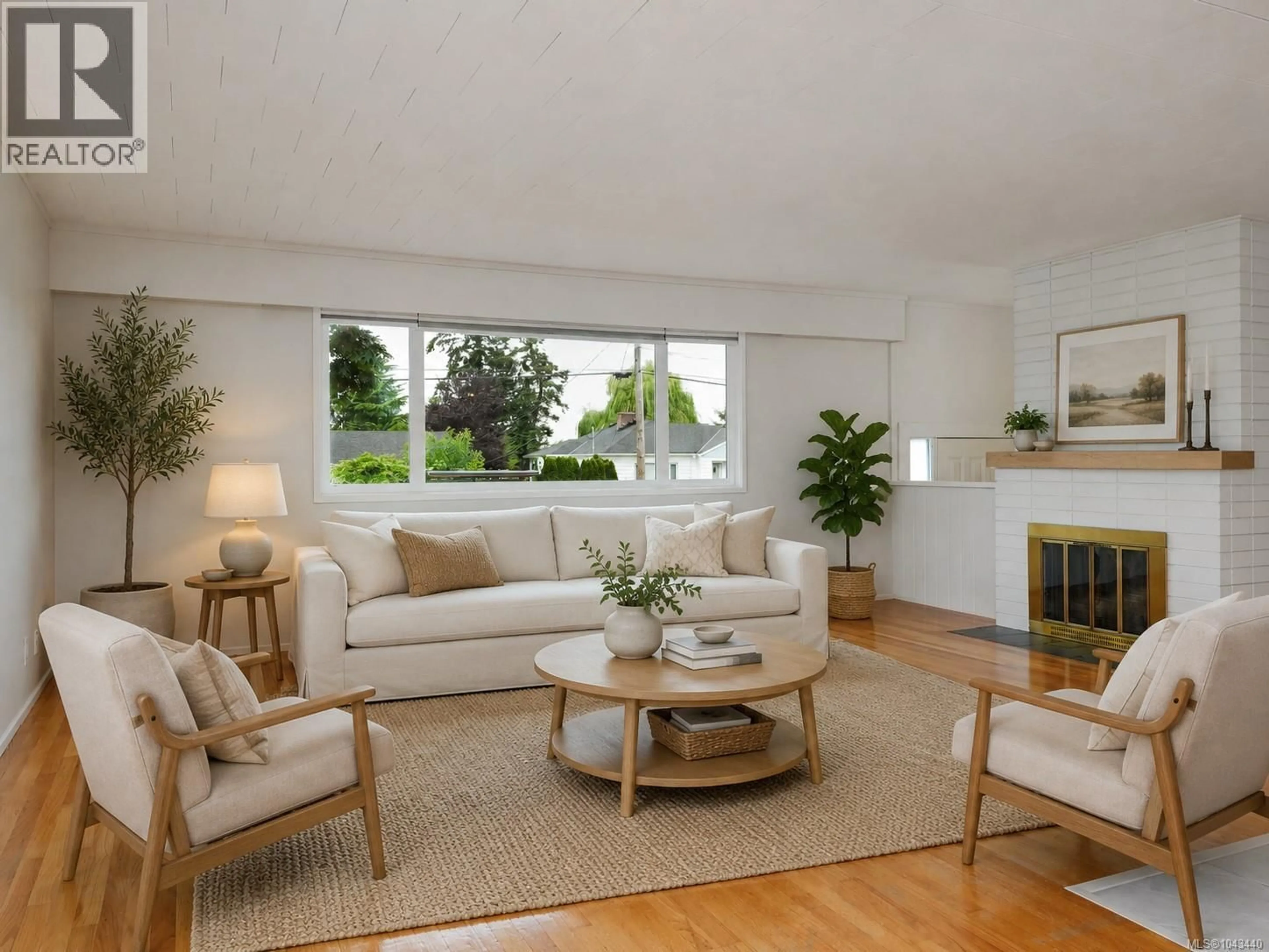 Living room with furniture, wood/laminate floor for 3871 CAREY ROAD, Saanich British Columbia V8Z4C8