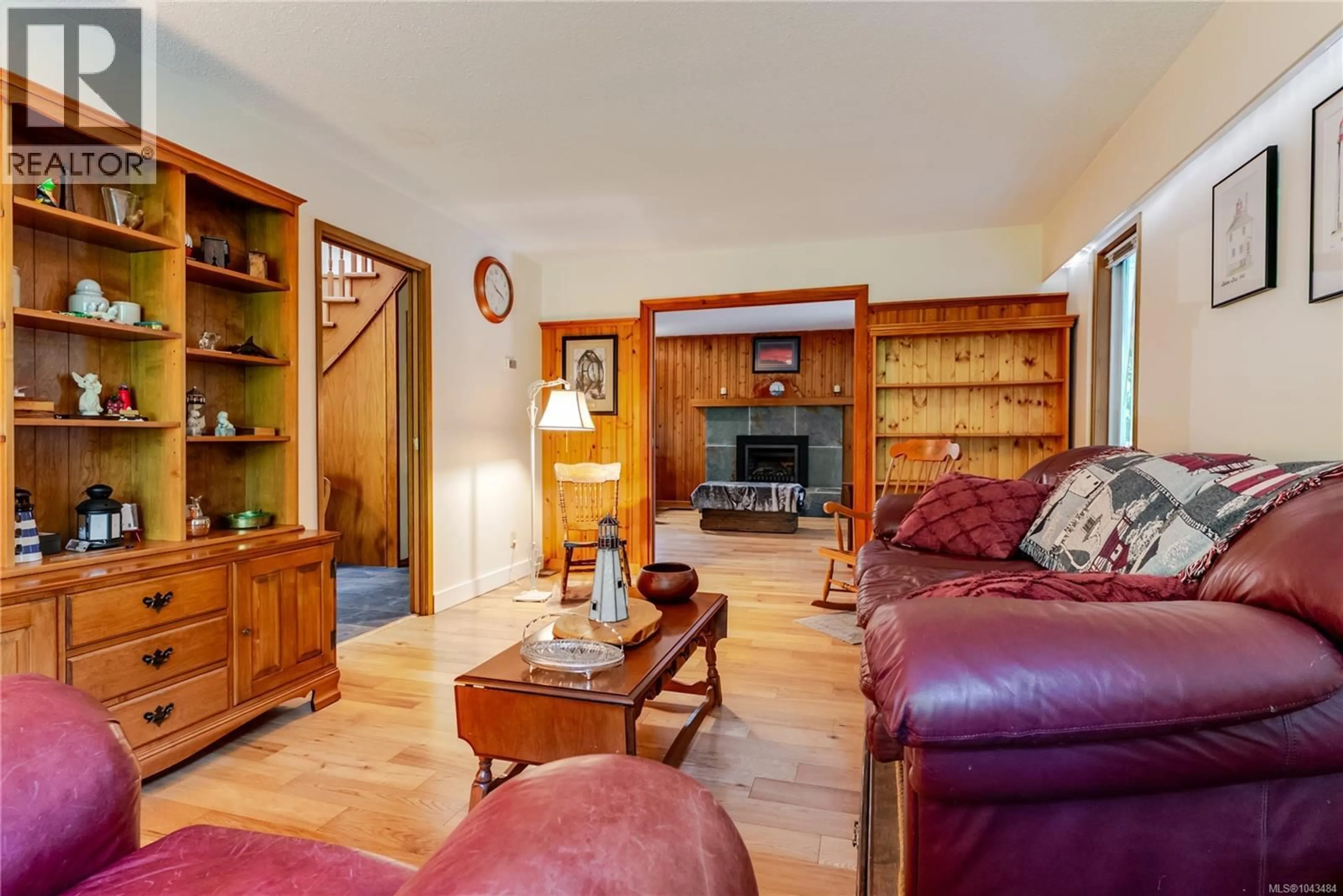 Living room with furniture, wood/laminate floor for 1970 LANDS END ROAD, North Saanich British Columbia V8L5J2