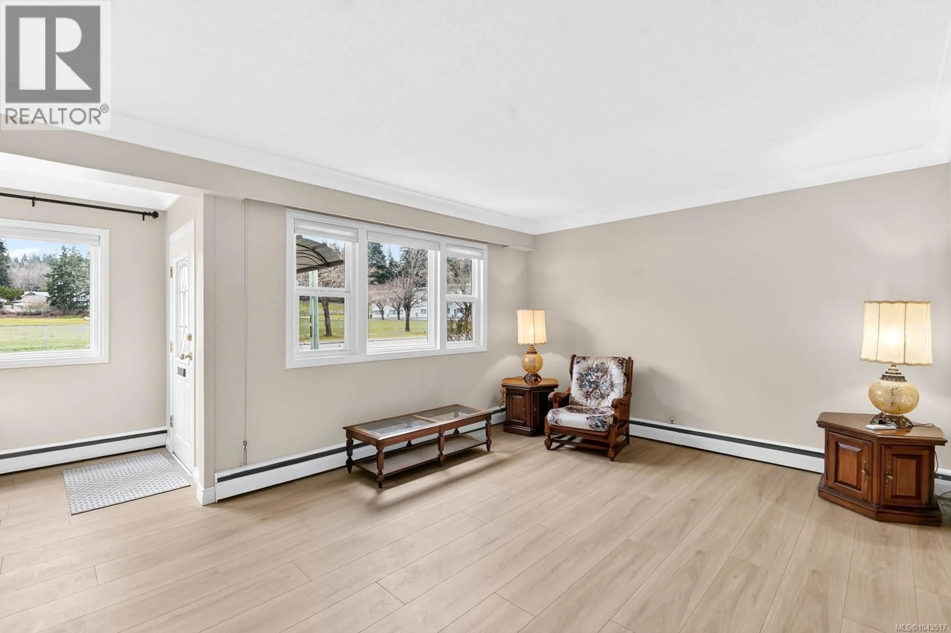 Living room with furniture, wood/laminate floor for 5118 COMPTON ROAD, Port Alberni British Columbia V9Y7A5