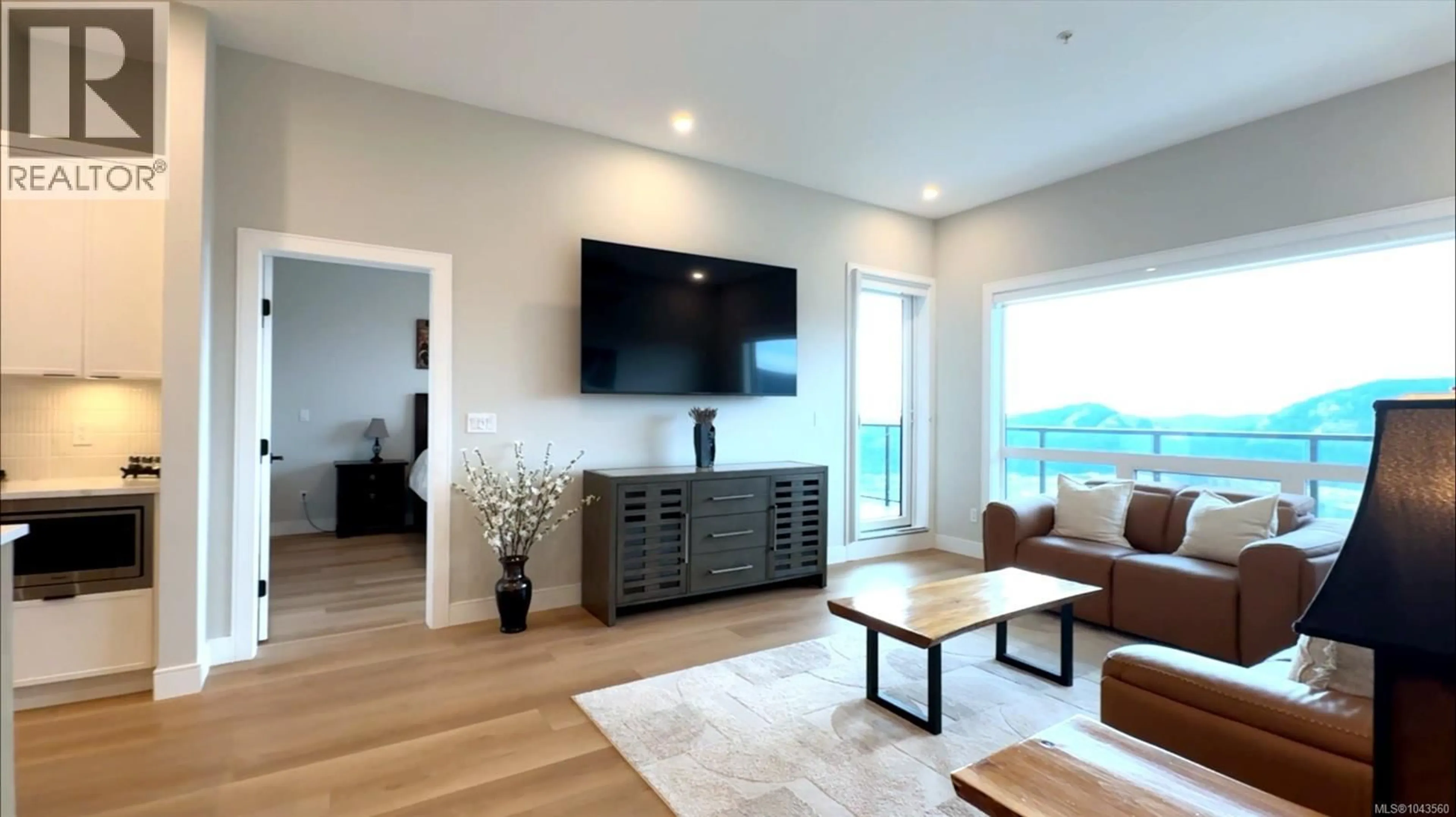 Living room with furniture, wood/laminate floor for 614 - 1810 SELENITE PLACE, Langford British Columbia V9B7E2