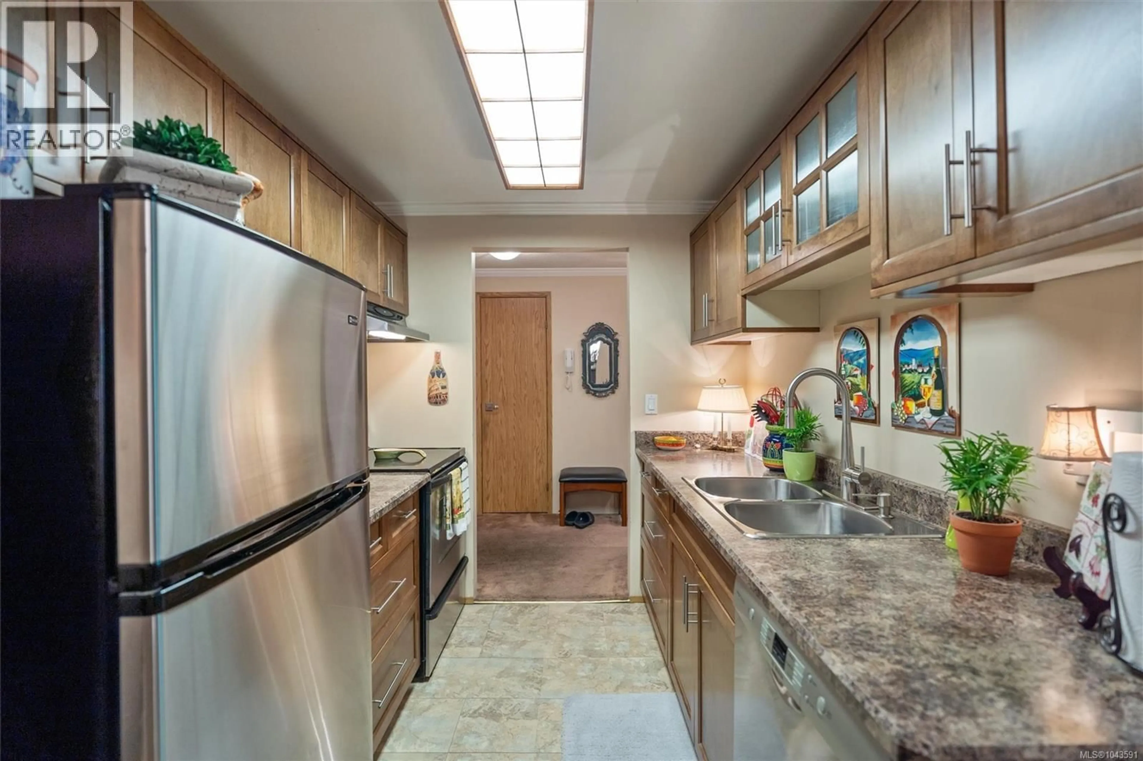 Standard kitchen, ceramic/tile floor for 303 - 1068 TOLMIE AVENUE, Saanich British Columbia V8X4T4