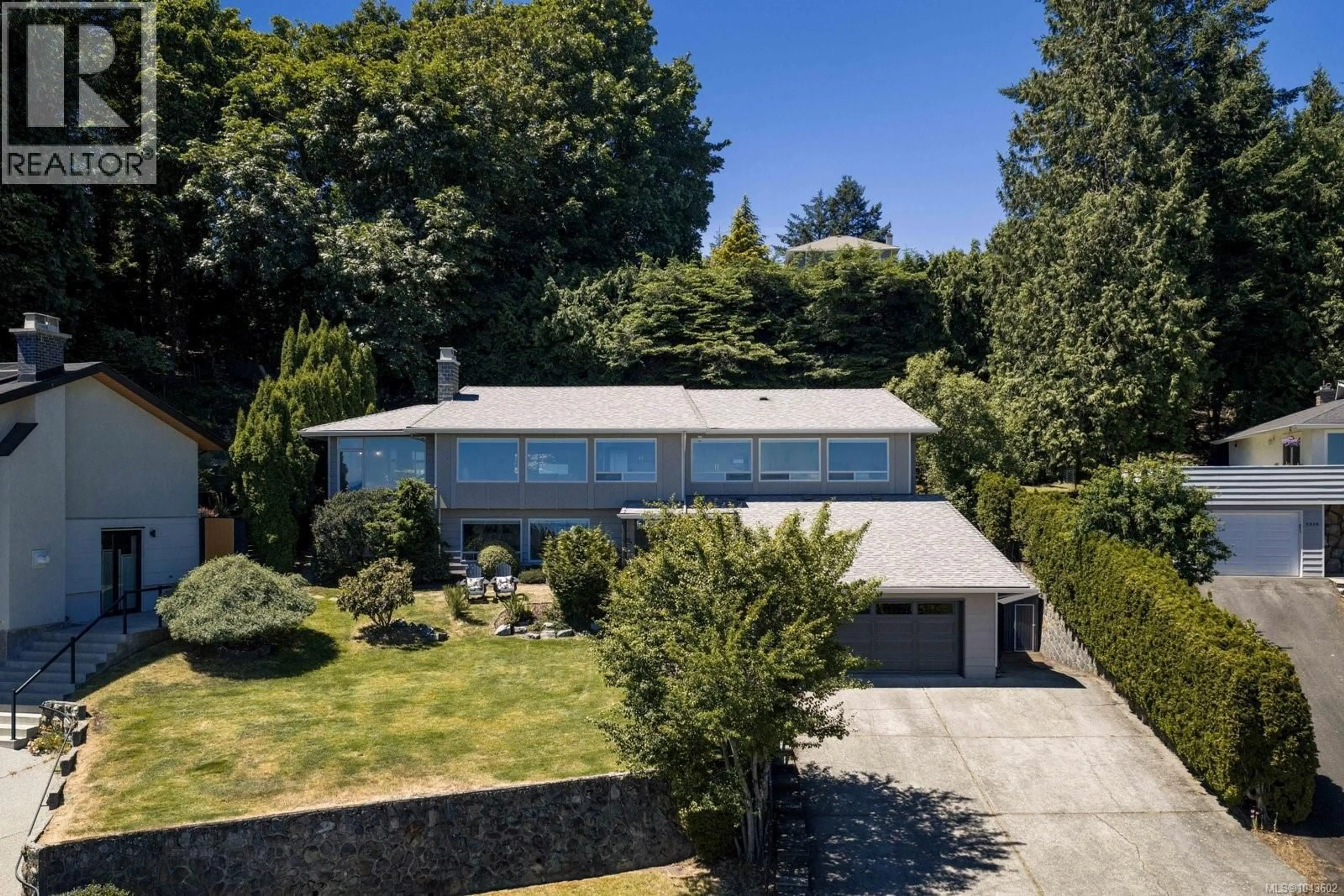 A pic from outside/outdoor area/front of a property/back of a property/a pic from drone, street for 5254 WESTOVER PLACE, Saanich British Columbia V8Y1P6
