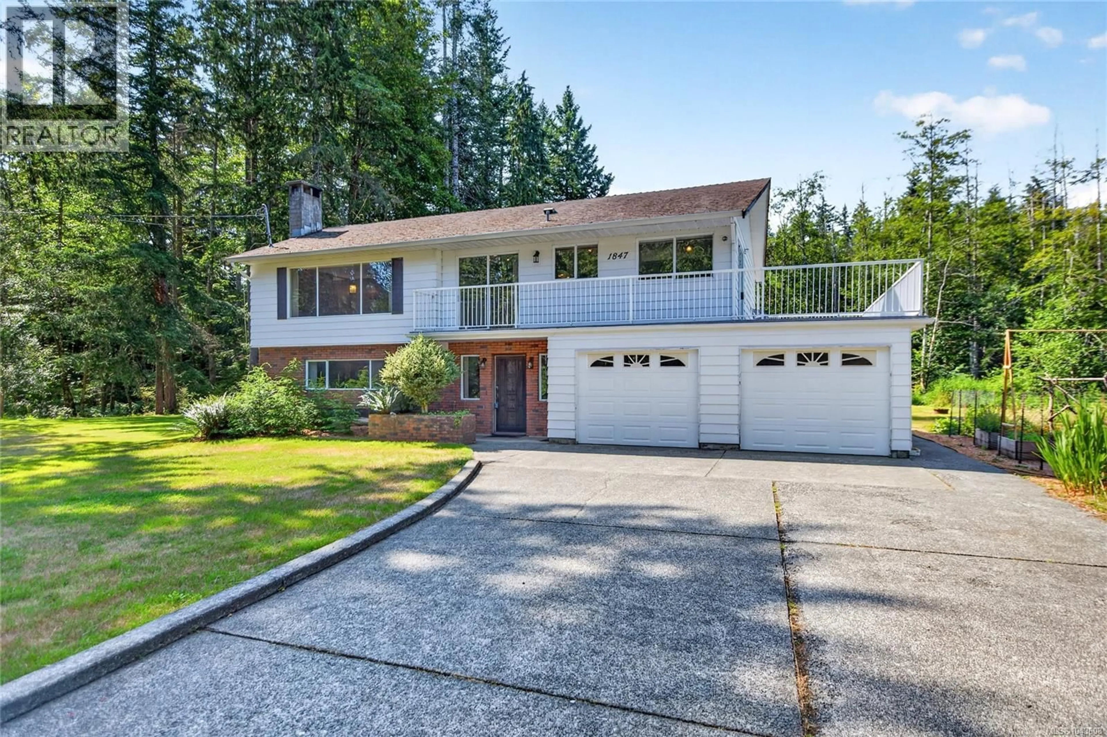 Home with vinyl exterior material, street for 1847 MIRACLE BEACH DRIVE, Black Creek British Columbia V9J1K1