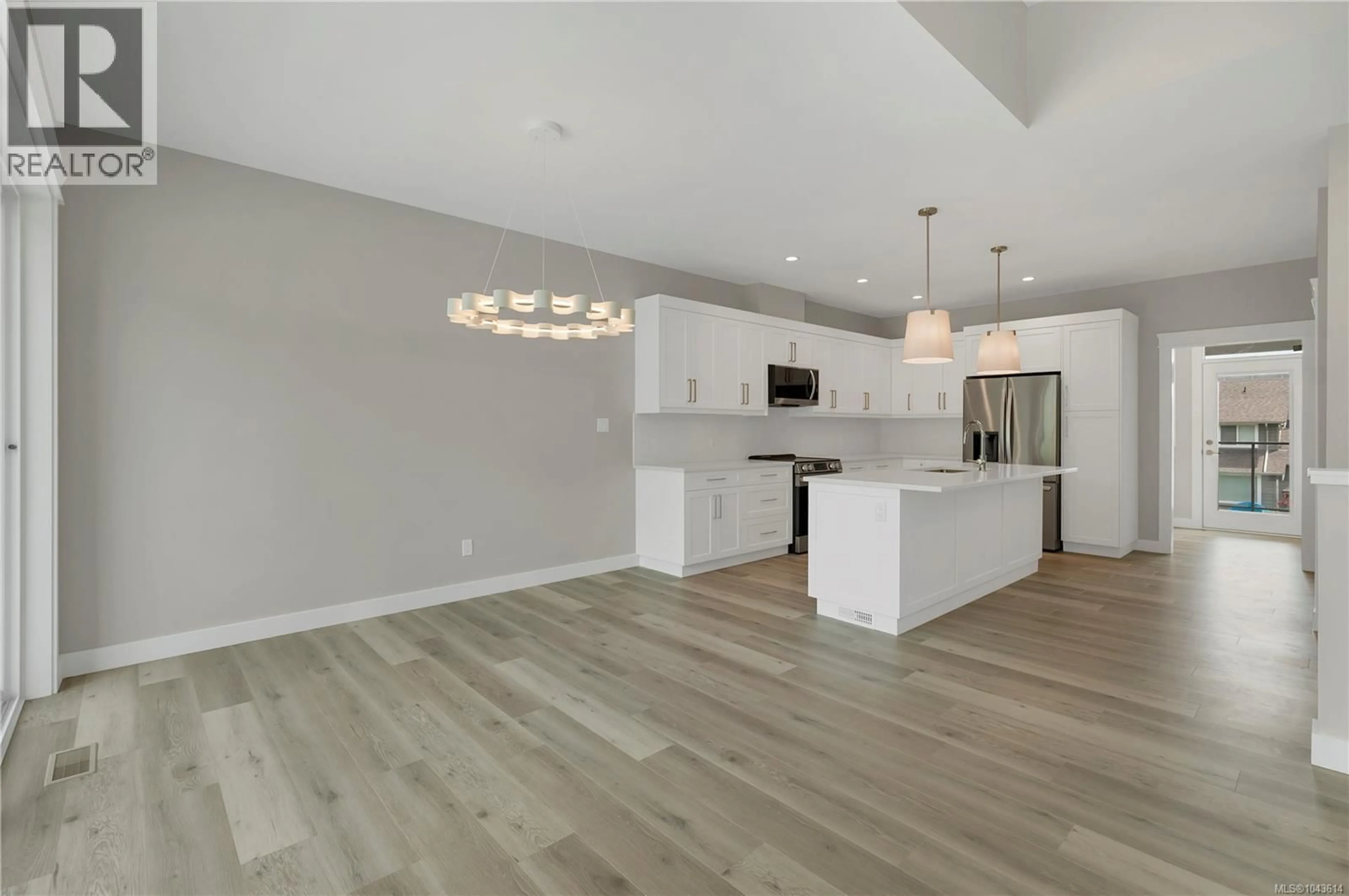 Open concept kitchen, wood/laminate floor for 241 WALWORTH ROAD SOUTH, Campbell River British Columbia V9W0J3