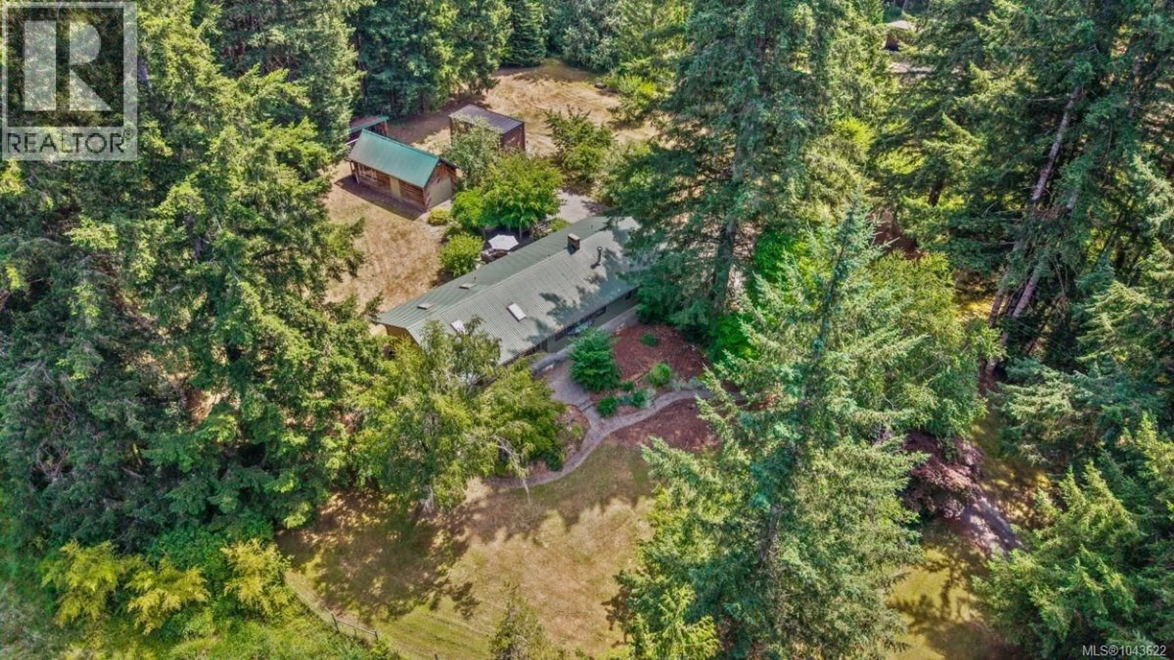 A pic from outside/outdoor area/front of a property/back of a property/a pic from drone, forest/trees view for 6004 NELSON ROAD, Courtenay British Columbia V9J1N9