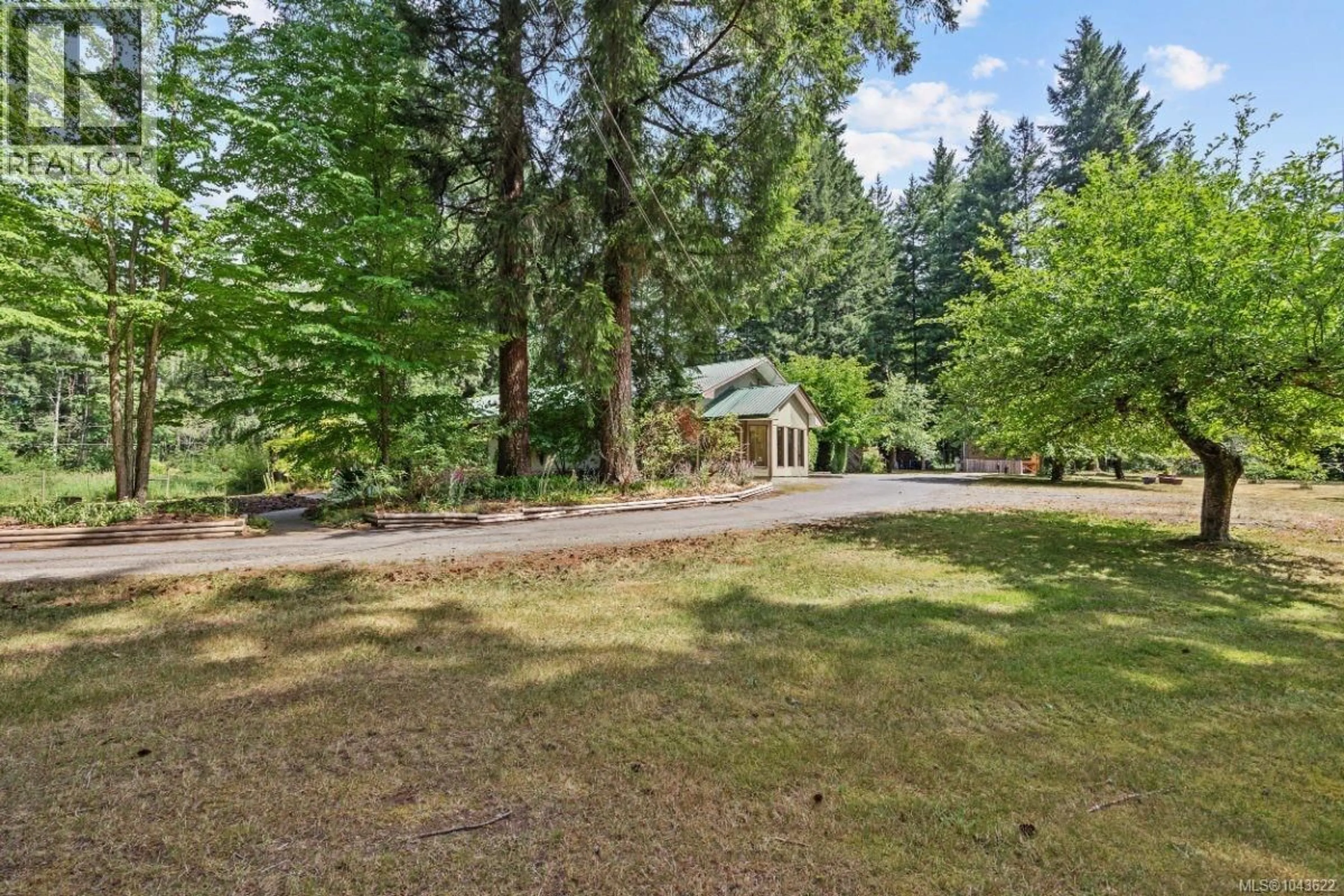 A pic from outside/outdoor area/front of a property/back of a property/a pic from drone, forest/trees view for 6004 NELSON ROAD, Courtenay British Columbia V9J1N9