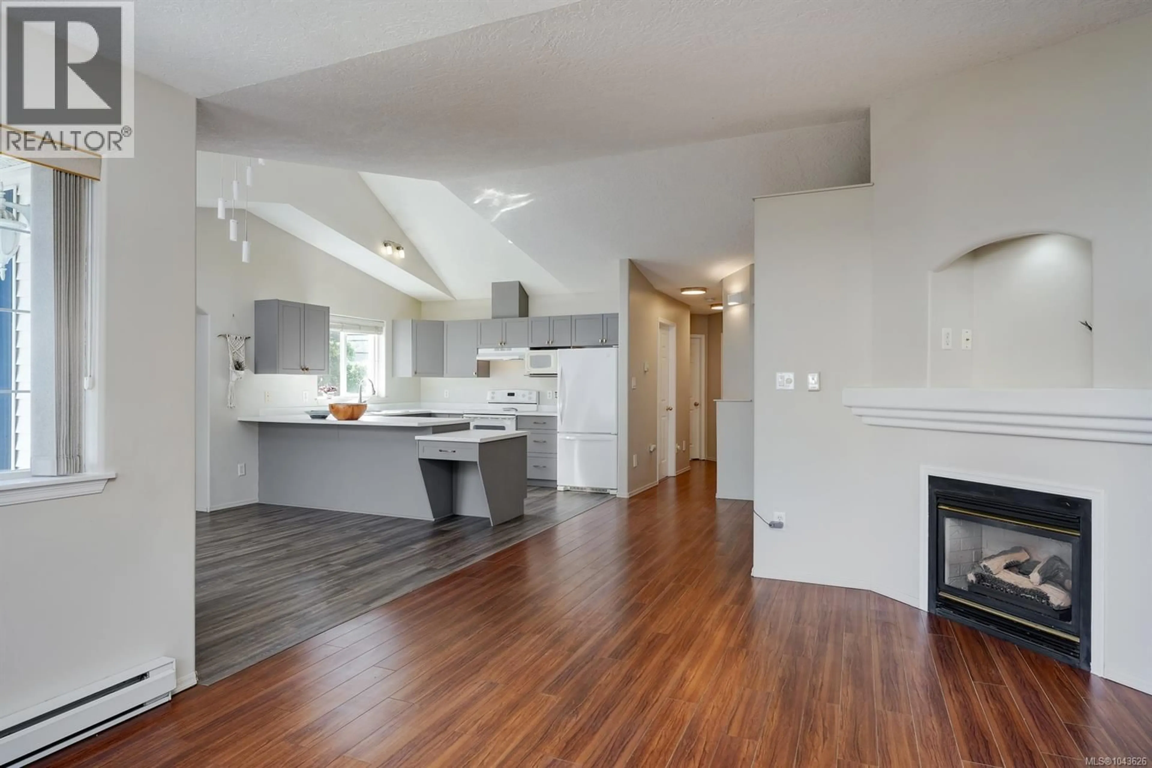 Open concept kitchen, wood/laminate floor for 2893 YOUNG PLACE, Langford British Columbia V9B6A1