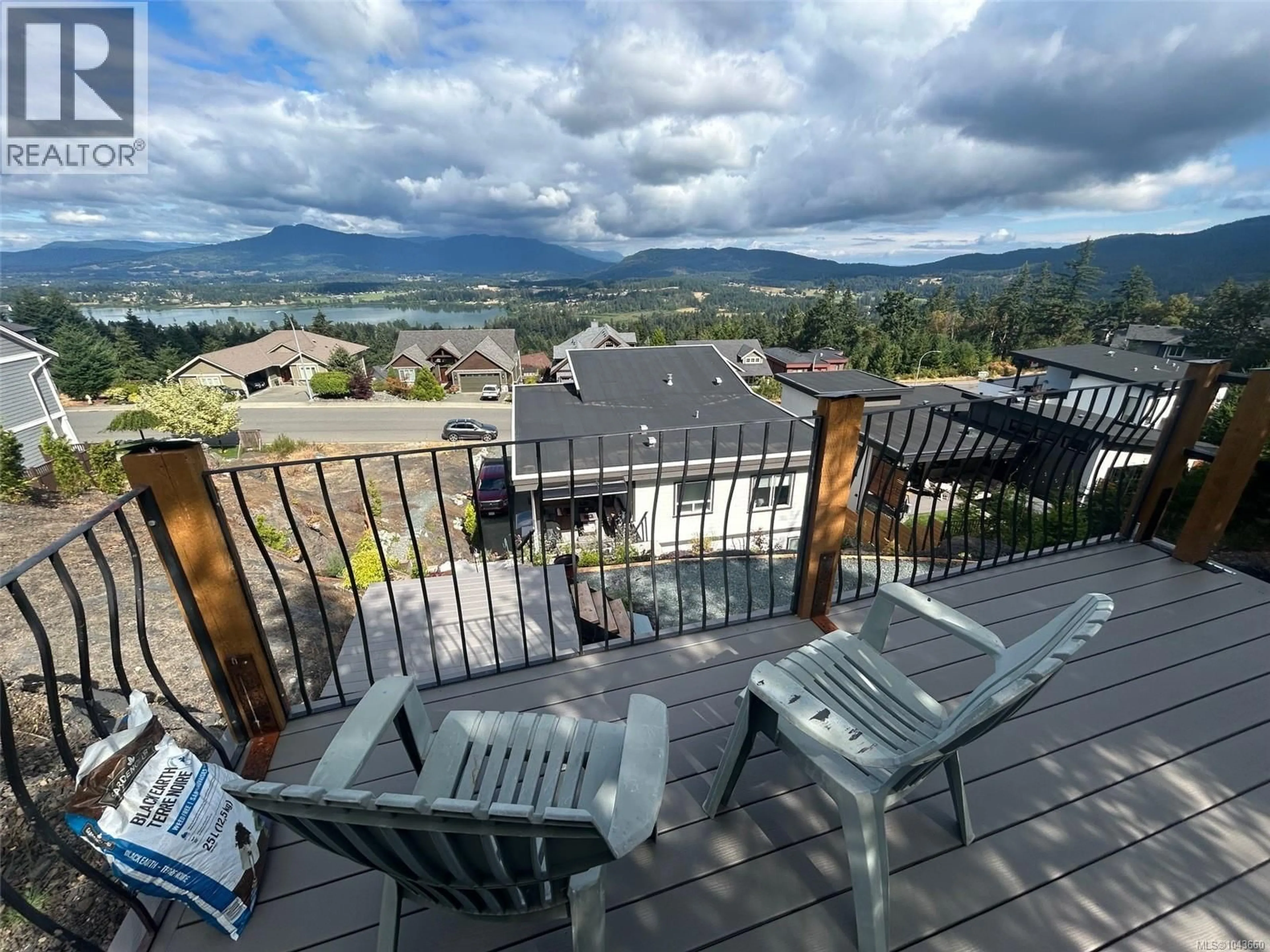 A pic from outside/outdoor area/front of a property/back of a property/a pic from drone, mountain view for 6089 SANSUM DRIVE, Duncan British Columbia V9L0B3
