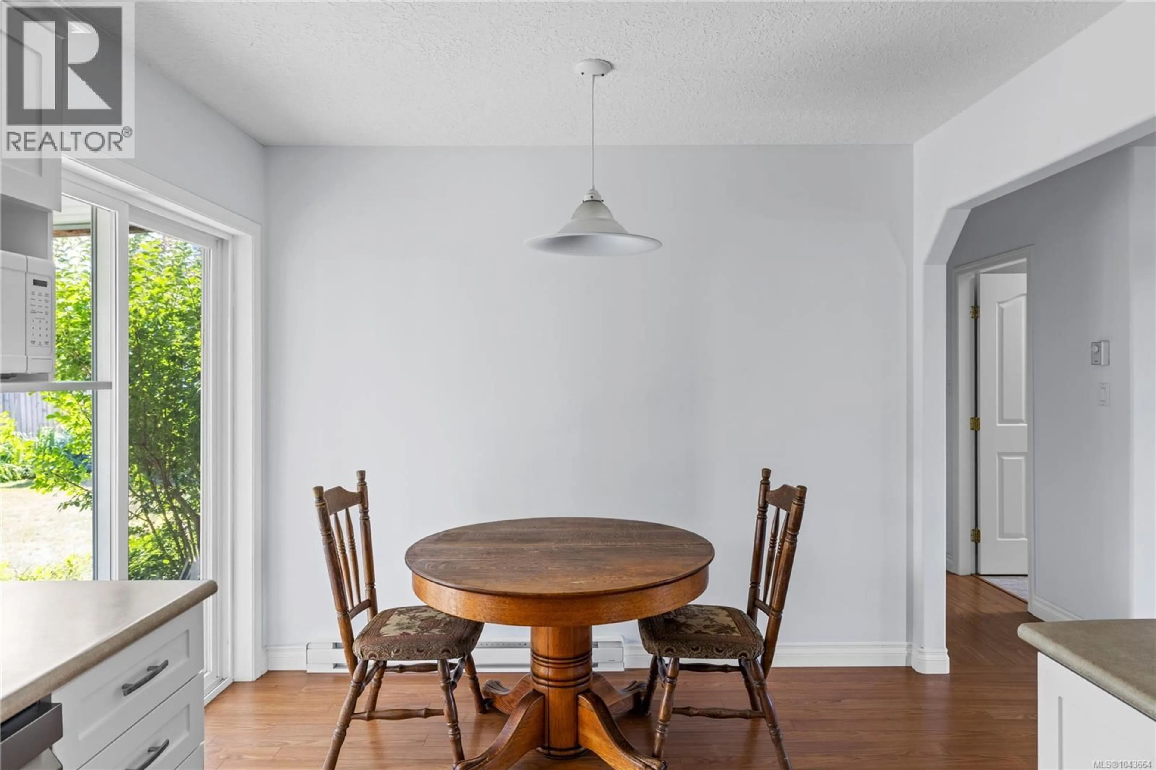 Dining room, wood/laminate floor for 238 STRAWBERRY CRESCENT, Parksville British Columbia V9P2W7