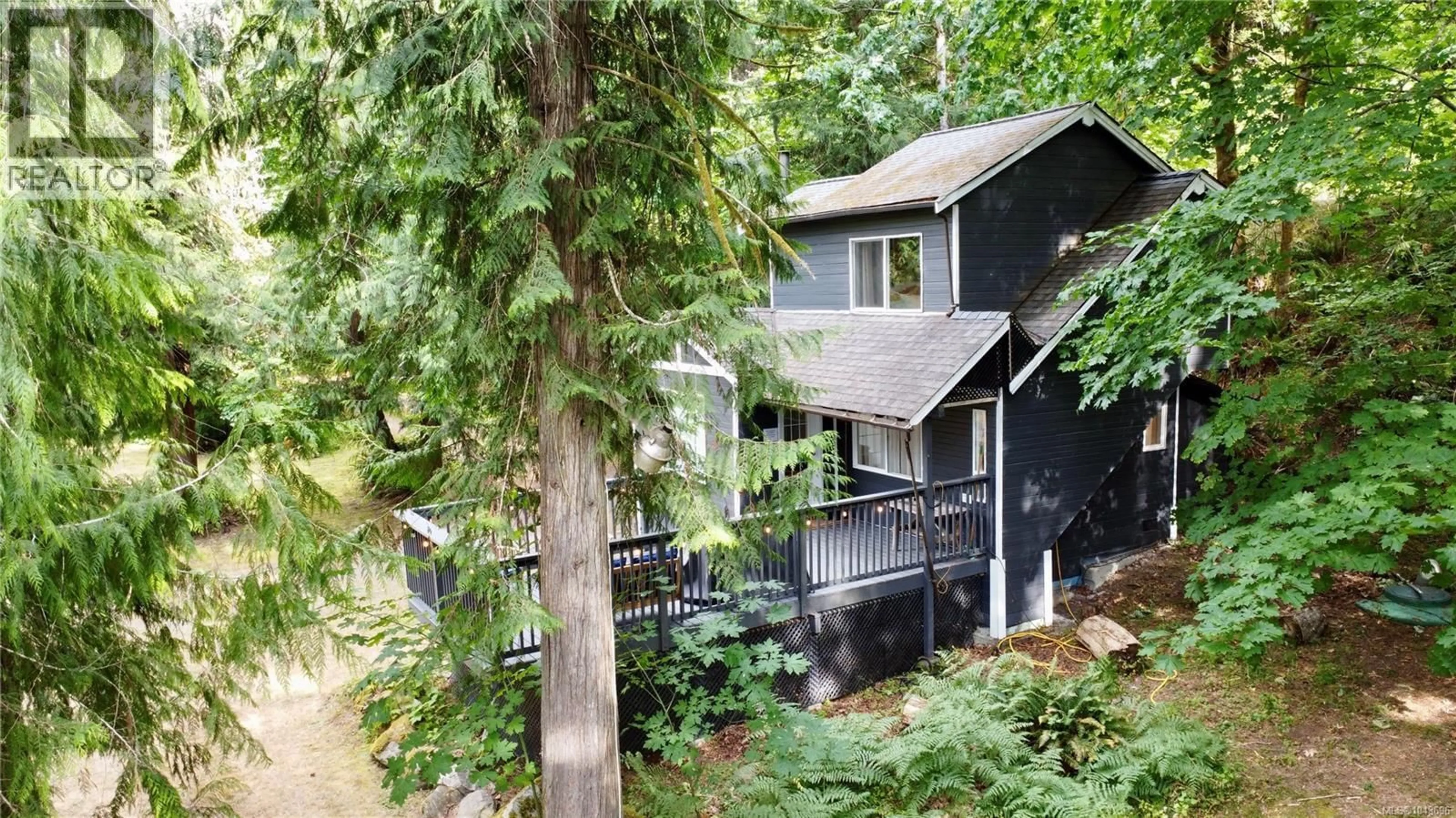 A pic from outside/outdoor area/front of a property/back of a property/a pic from drone, forest/trees view for 4021 JOHN'S ROAD, Duncan British Columbia V9L6S7