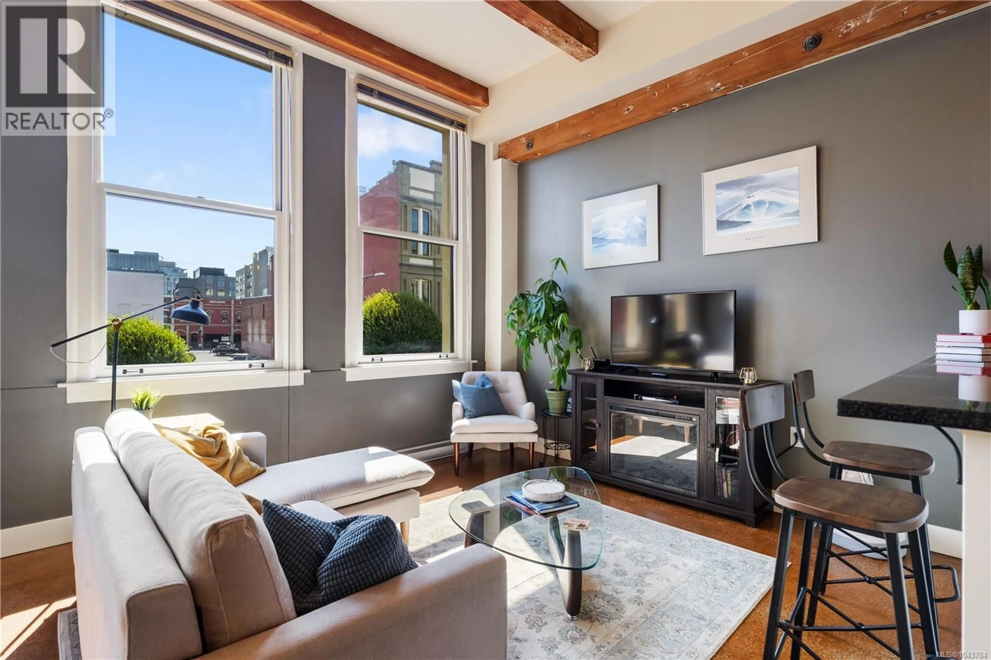 Living room with furniture, unknown for 212 - 599 PANDORA AVENUE, Victoria British Columbia V8W1N5