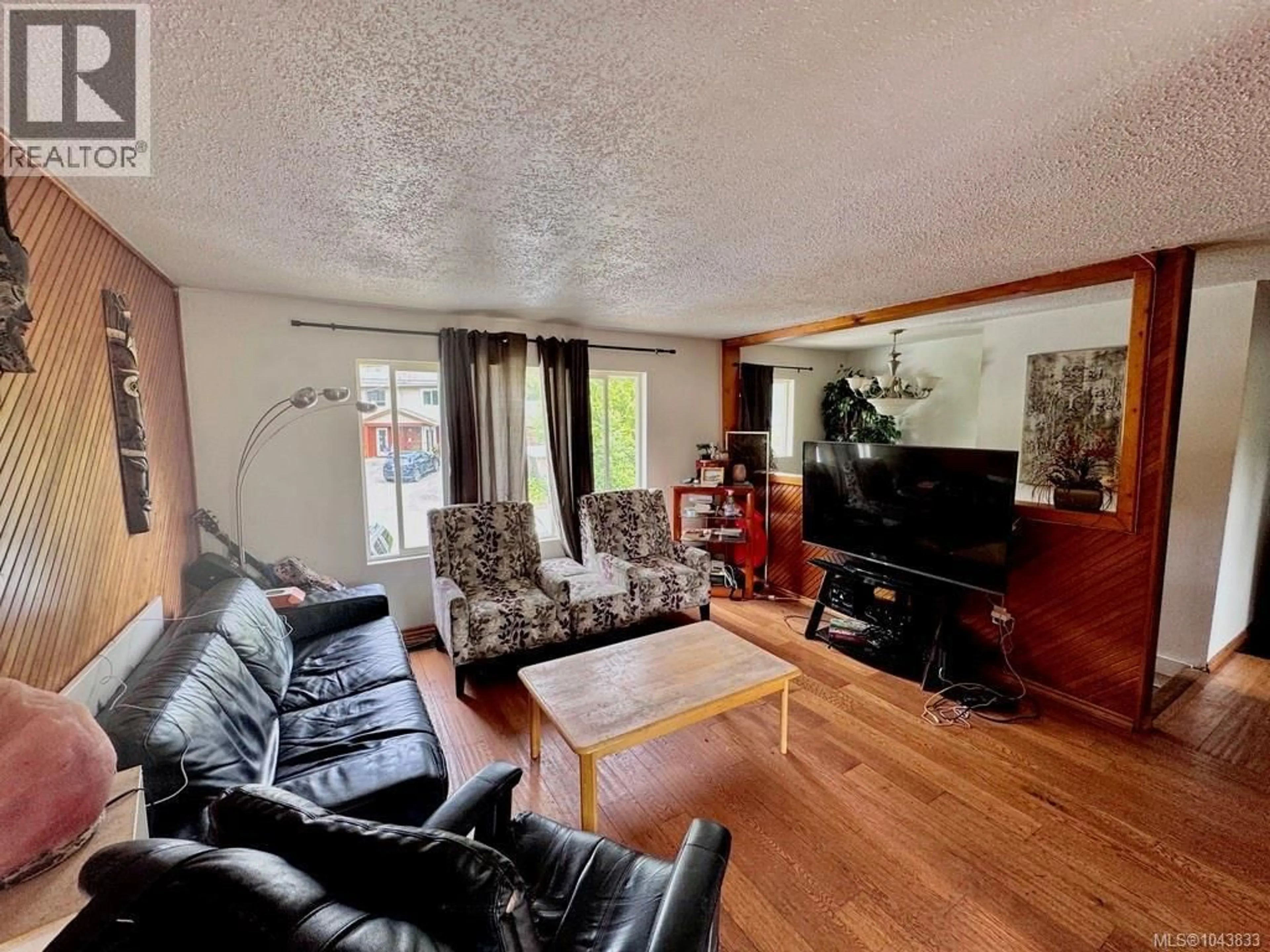 Living room with furniture, wood/laminate floor for 1690 HOLLY CRESCENT, Ucluelet British Columbia V0R3A0