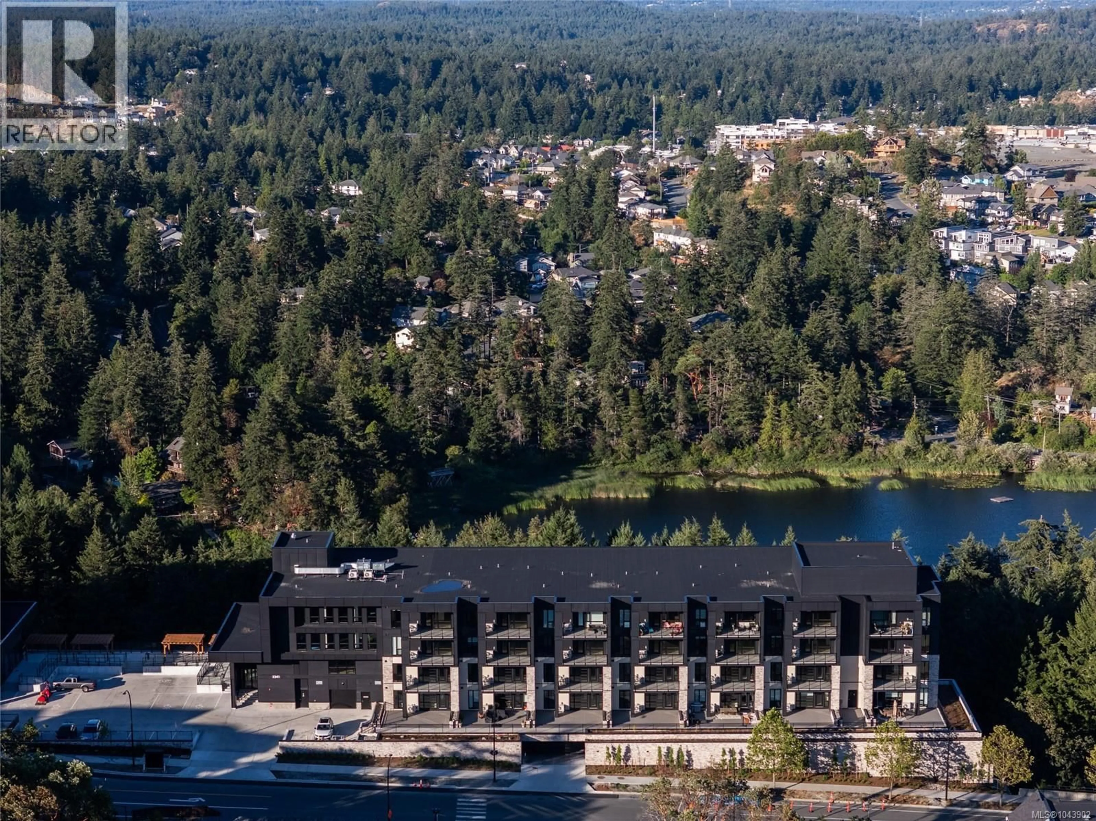 A pic from outside/outdoor area/front of a property/back of a property/a pic from drone, water/lake/river/ocean view for 212 - 2341 BEAR MOUNTAIN PARKWAY, Langford British Columbia V9B6V1