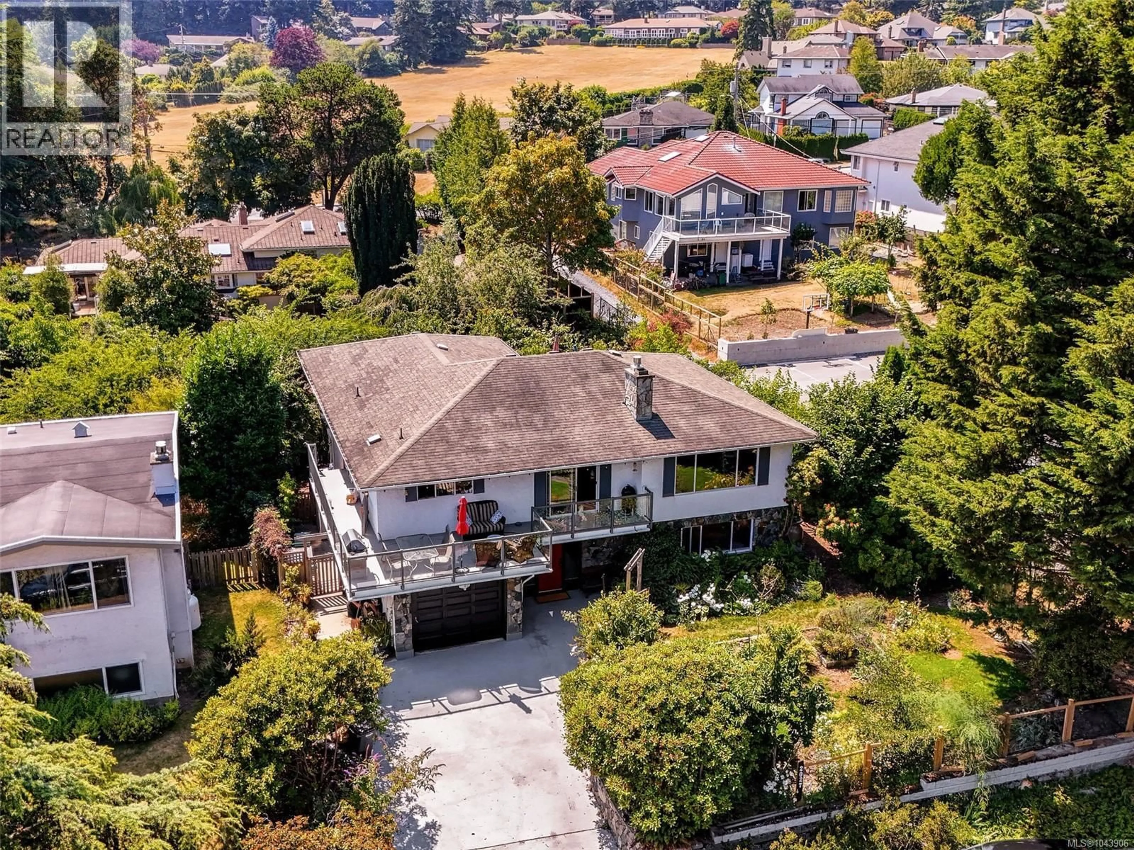 A pic from outside/outdoor area/front of a property/back of a property/a pic from drone, street for 2027 SALTAIR PLACE, Saanich British Columbia V8N4S4