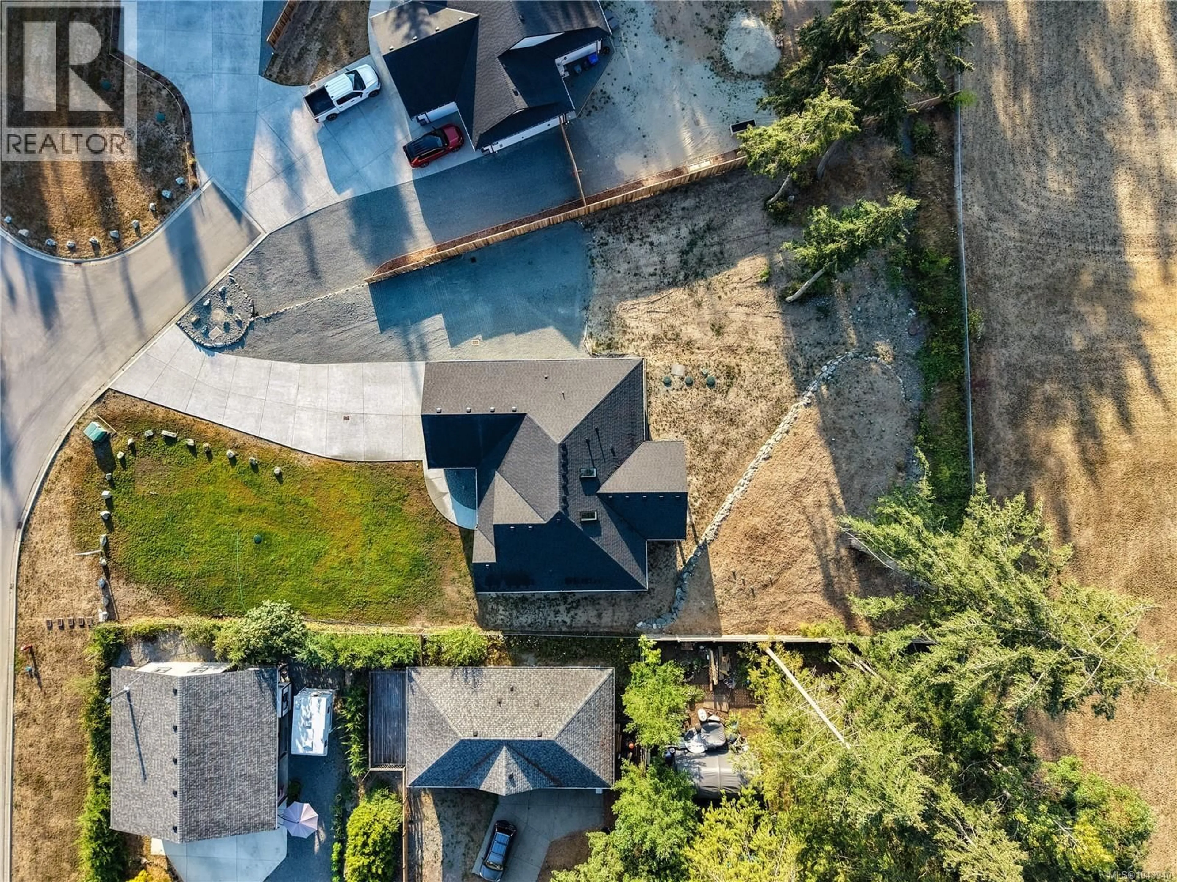 A pic from outside/outdoor area/front of a property/back of a property/a pic from drone, street for 1948 WOOBANK ROAD, Nanaimo British Columbia V9X1H4