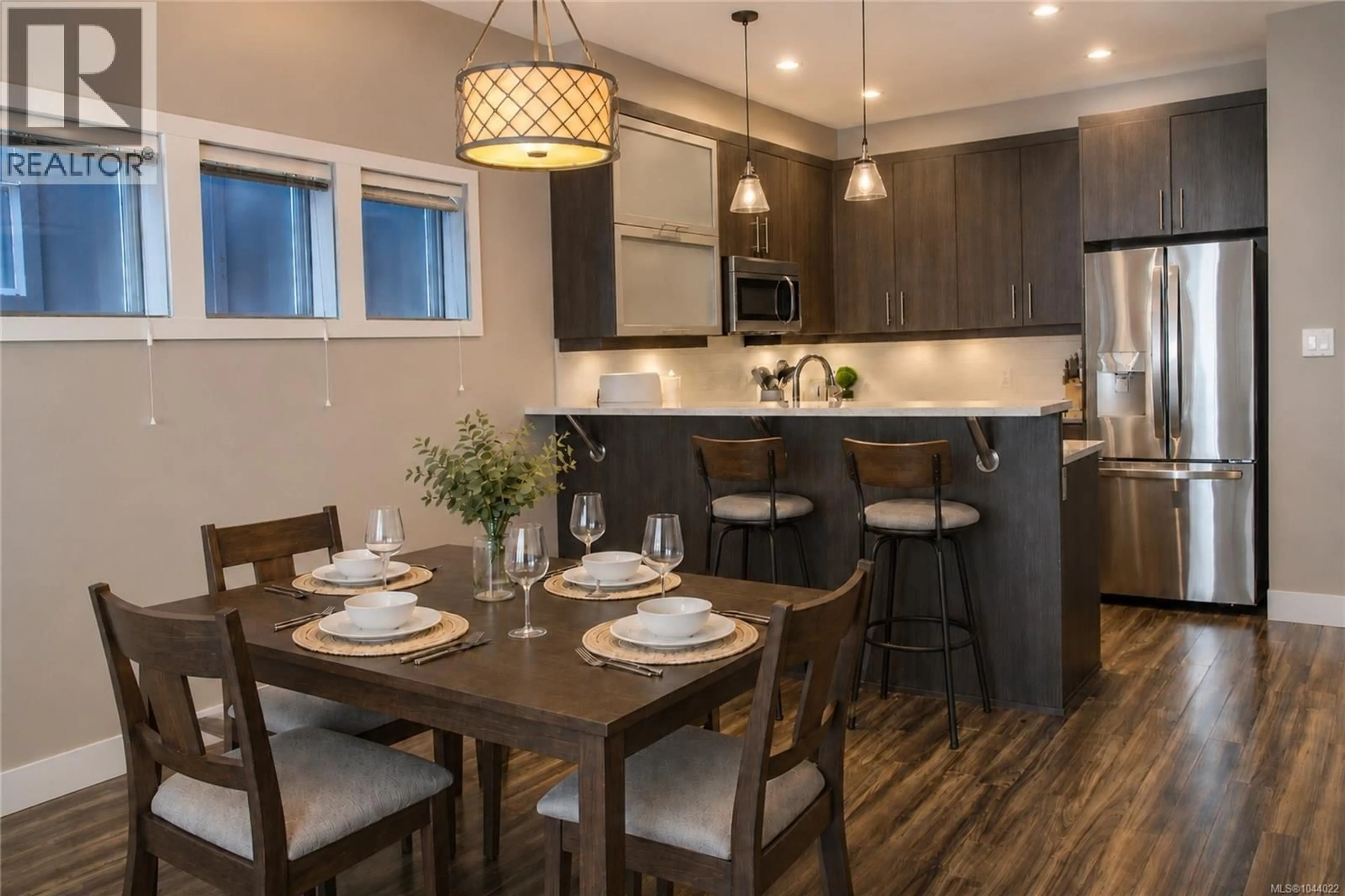 Open concept kitchen, wood/laminate floor for 108 - 2726 PEATT ROAD, Langford British Columbia V9B3V3