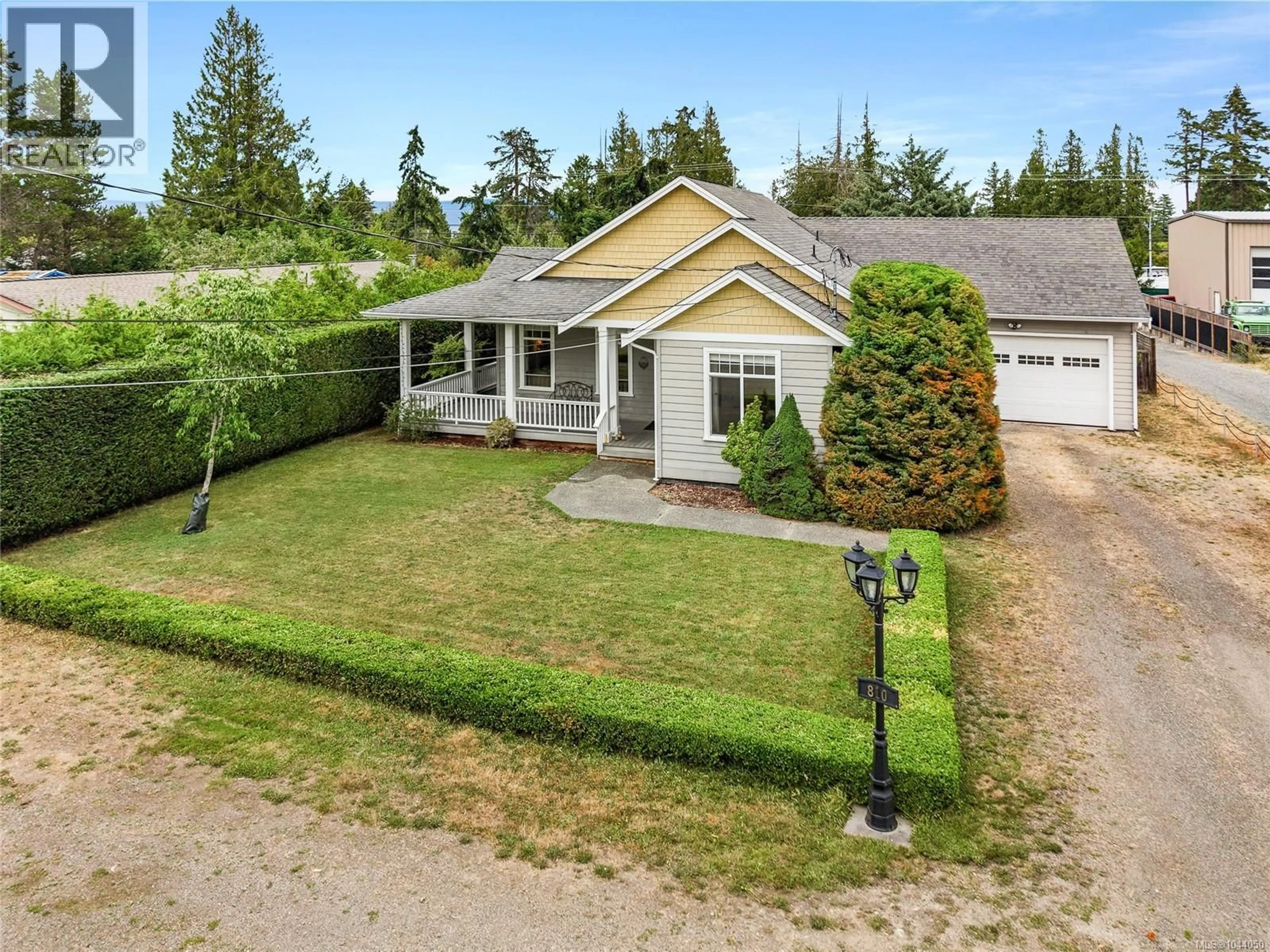 A pic from outside/outdoor area/front of a property/back of a property/a pic from drone, street for 810 REID ROAD, French Creek British Columbia V9P2E6