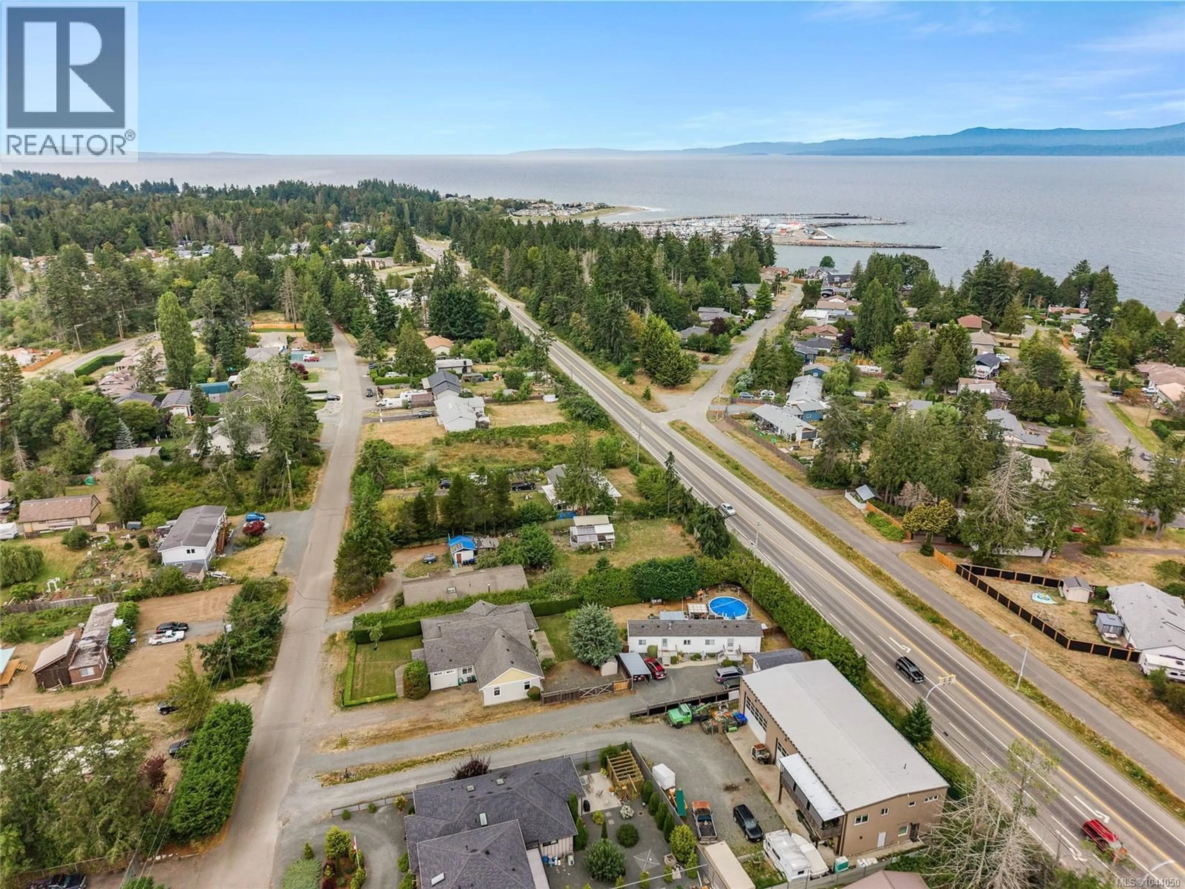 A pic from outside/outdoor area/front of a property/back of a property/a pic from drone, water/lake/river/ocean view for 810 REID ROAD, French Creek British Columbia V9P2E6