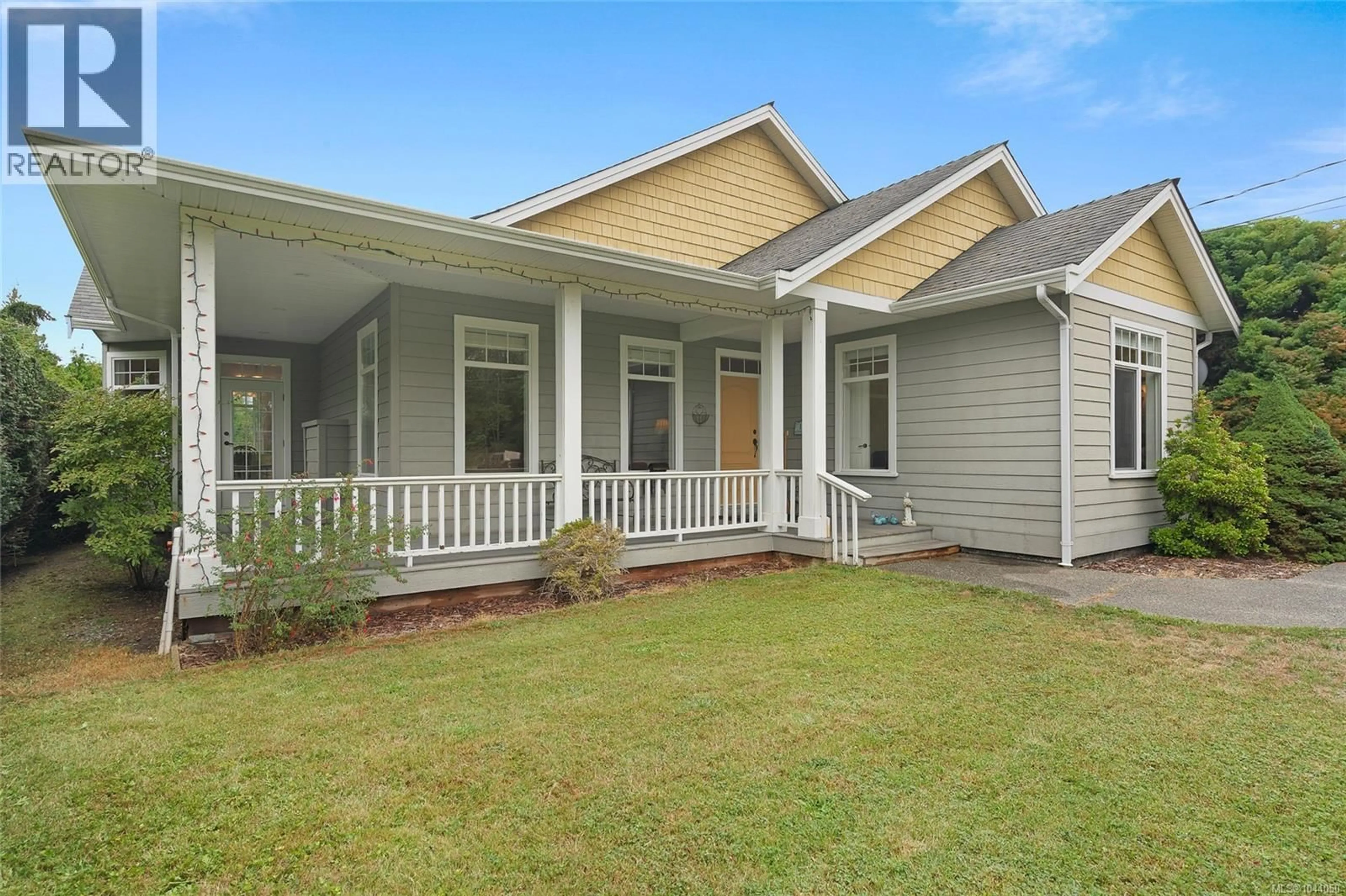 Home with vinyl exterior material, street for 810 REID ROAD, French Creek British Columbia V9P2E6