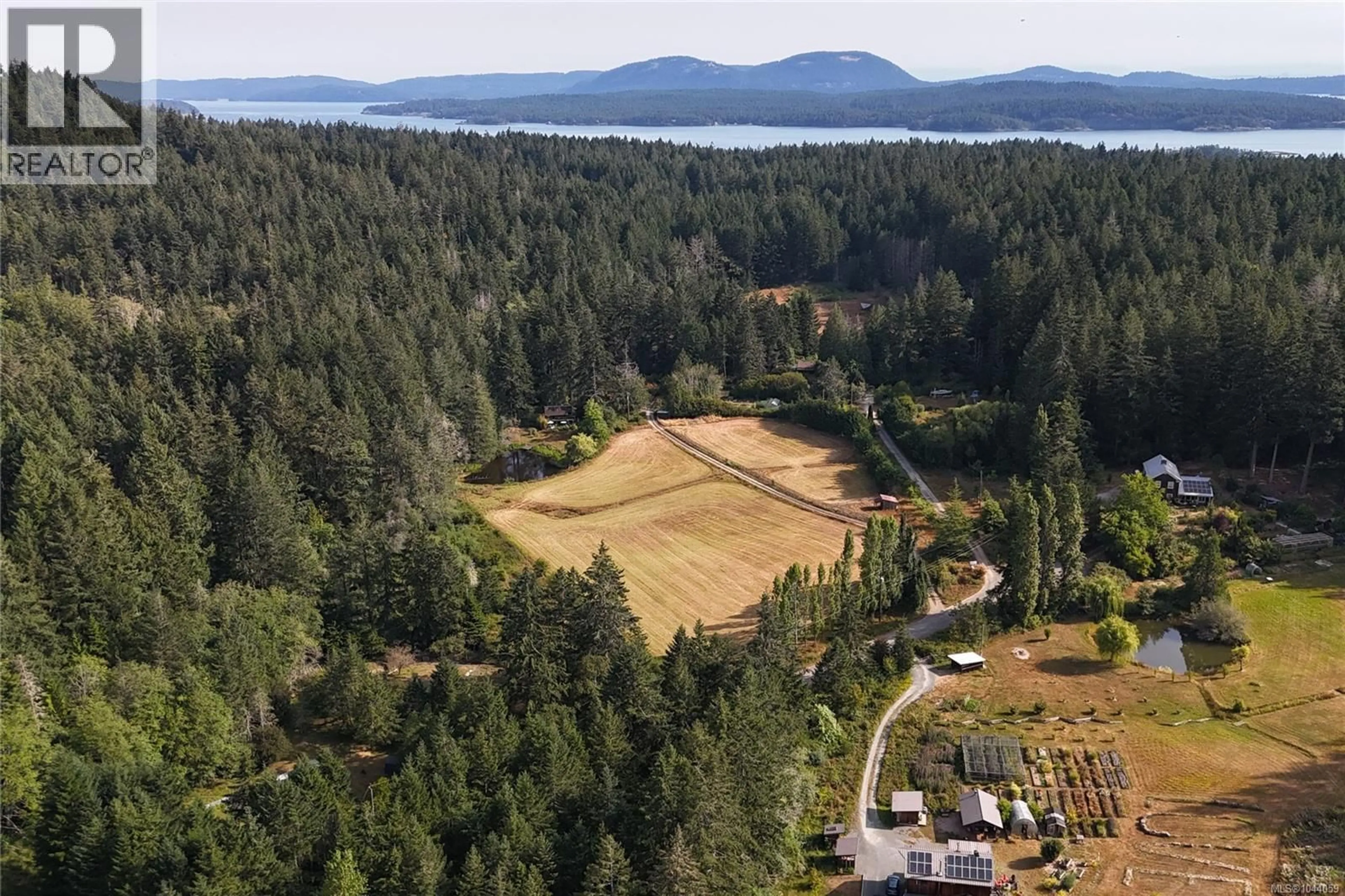 A pic from outside/outdoor area/front of a property/back of a property/a pic from drone, forest/trees view for 190 MCLENNAN DRIVE, Salt Spring British Columbia V8K1X2