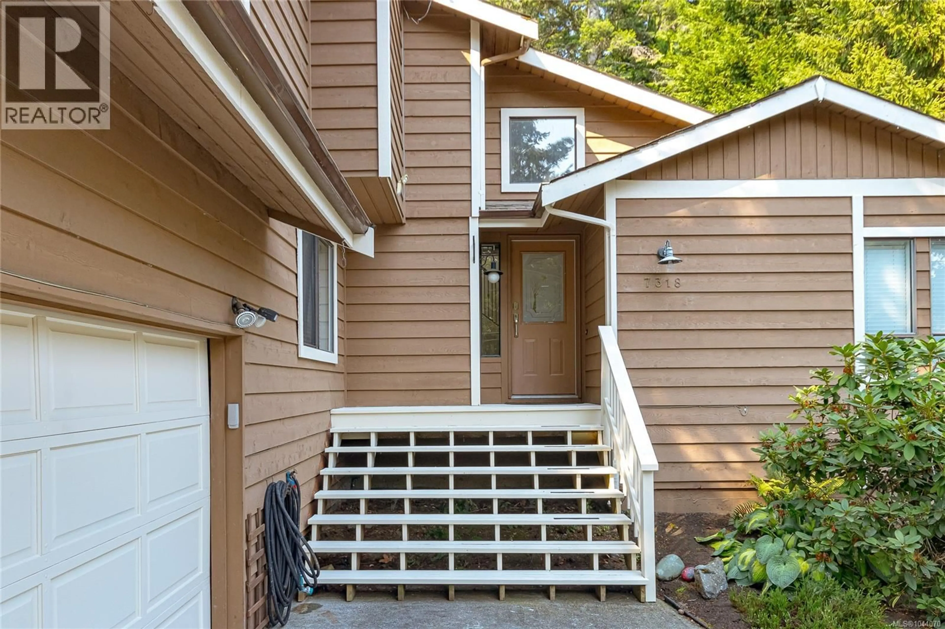 Home with vinyl exterior material, street for 7318 VEYANESS ROAD, Central Saanich British Columbia V8M1M3
