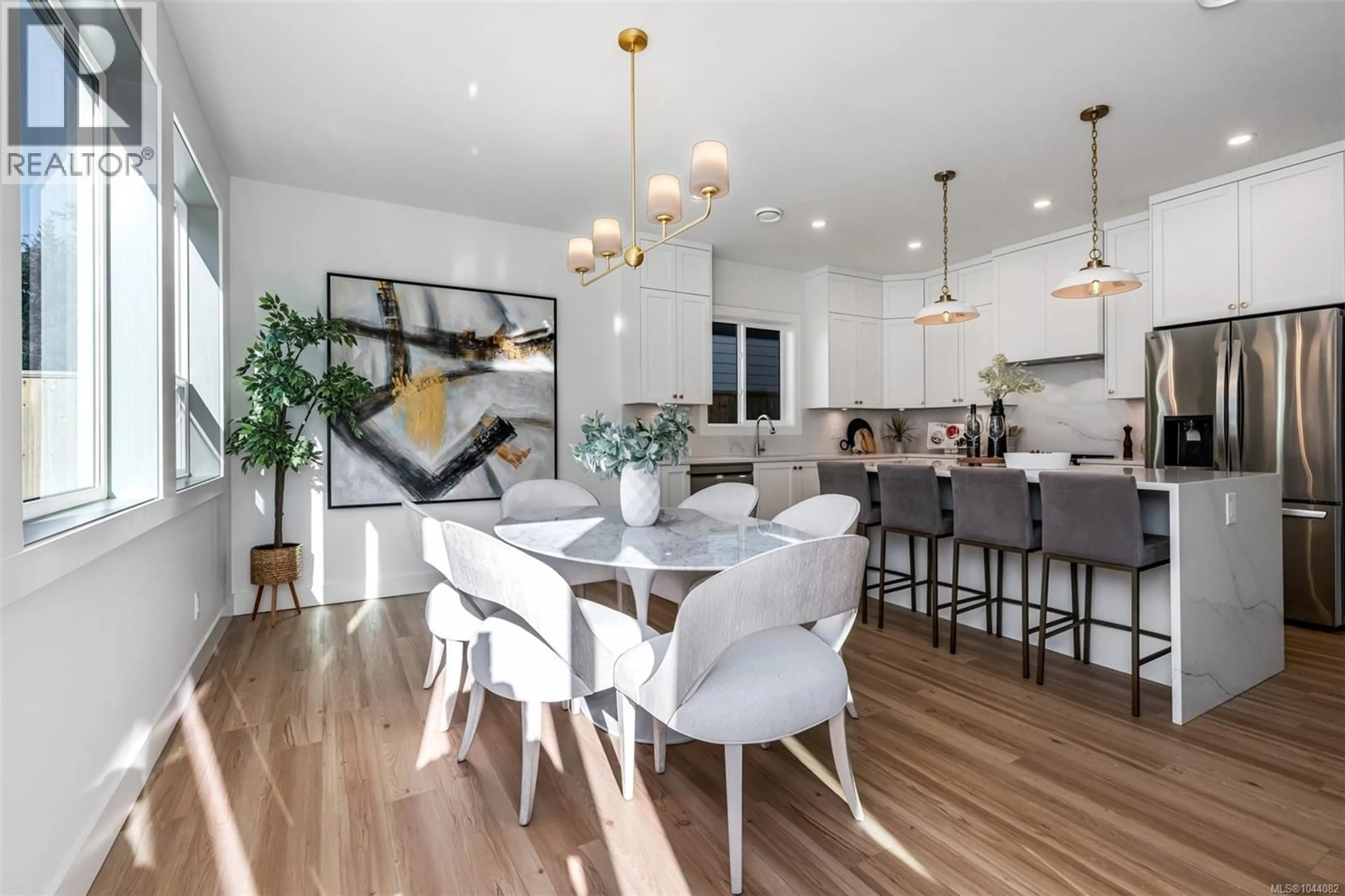 Open concept kitchen, wood/laminate floor for 654 WISTERIA RIDGE, Langford British Columbia V9B3N4