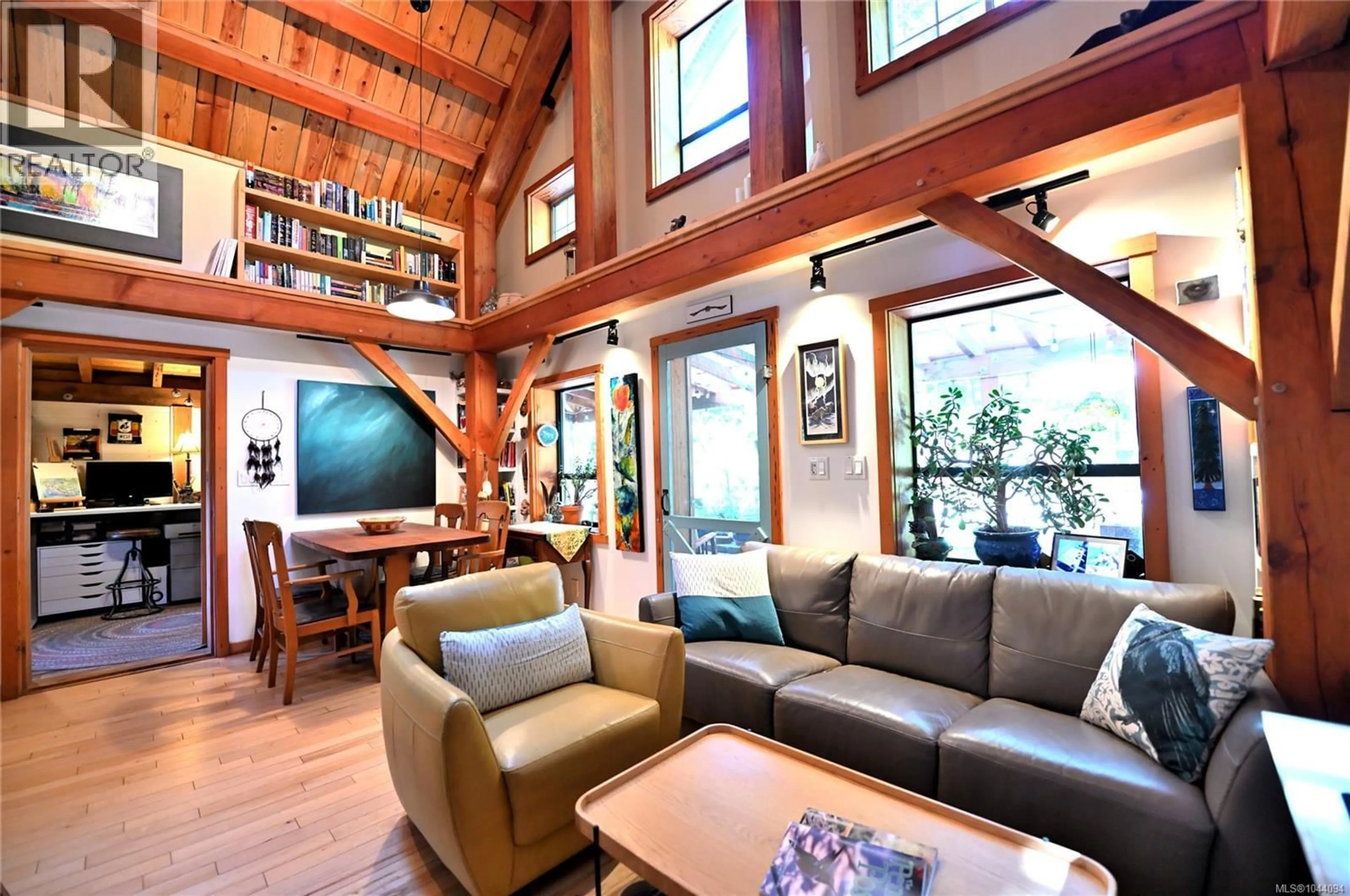 Living room with furniture, wood/laminate floor for 4873 PIRATES ROAD, Pender Island British Columbia V0N2M0