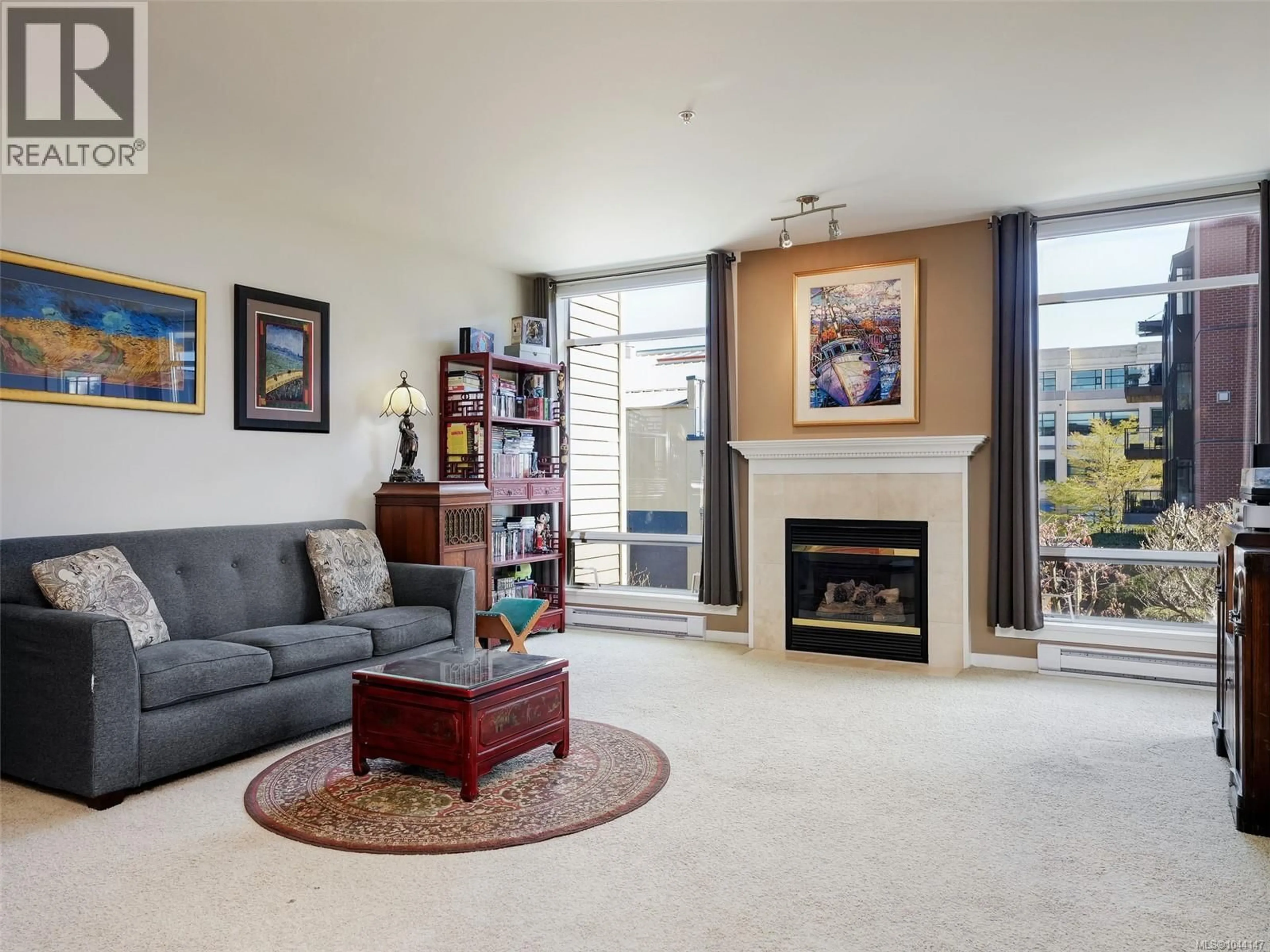 Living room with furniture, ceramic/tile floor for 206 - 330 WATERFRONT CRESCENT, Victoria British Columbia V8T5K3