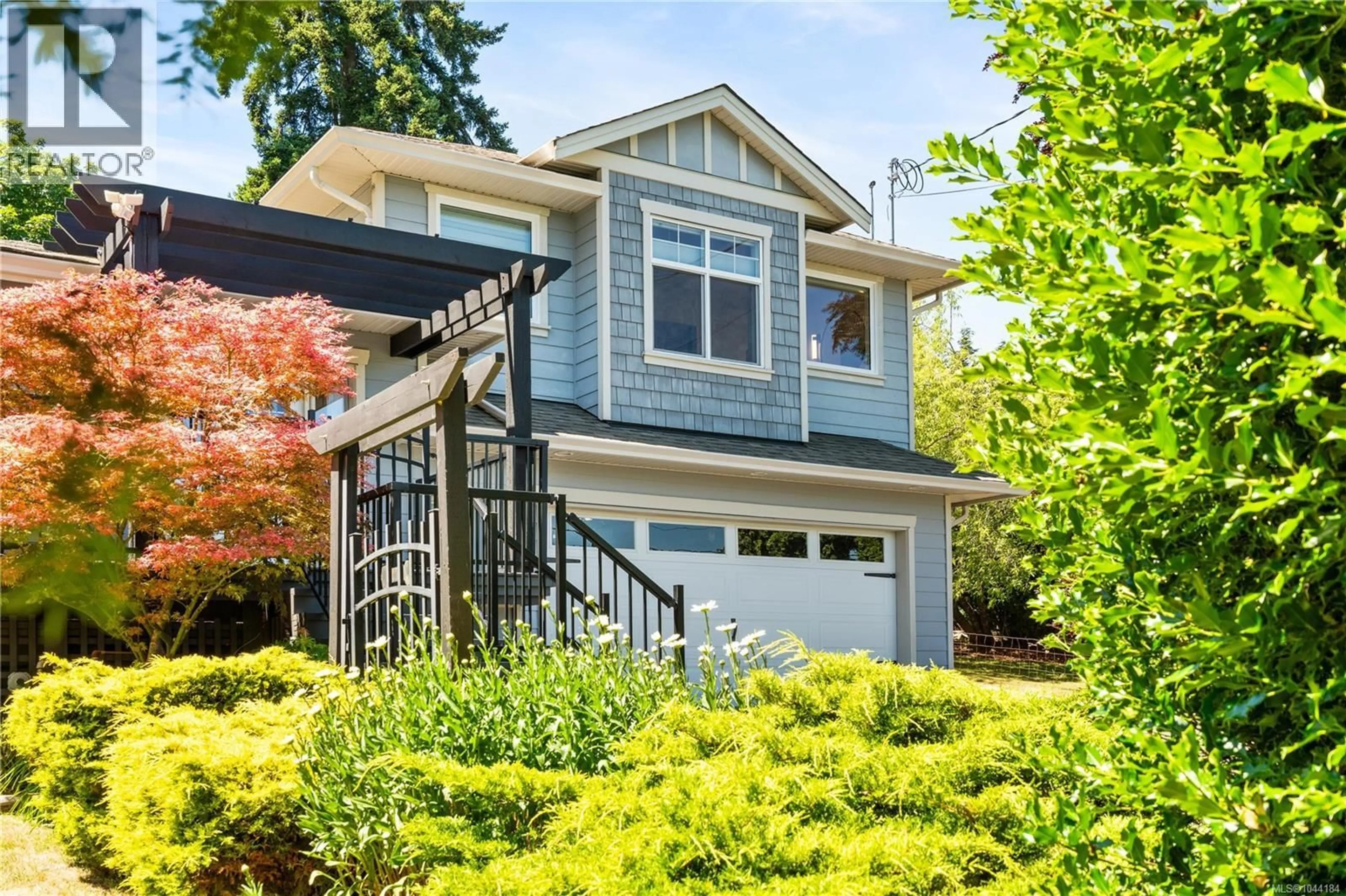 Home with vinyl exterior material, street for 2618 MILL BAY ROAD, Mill Bay British Columbia V8H1C9