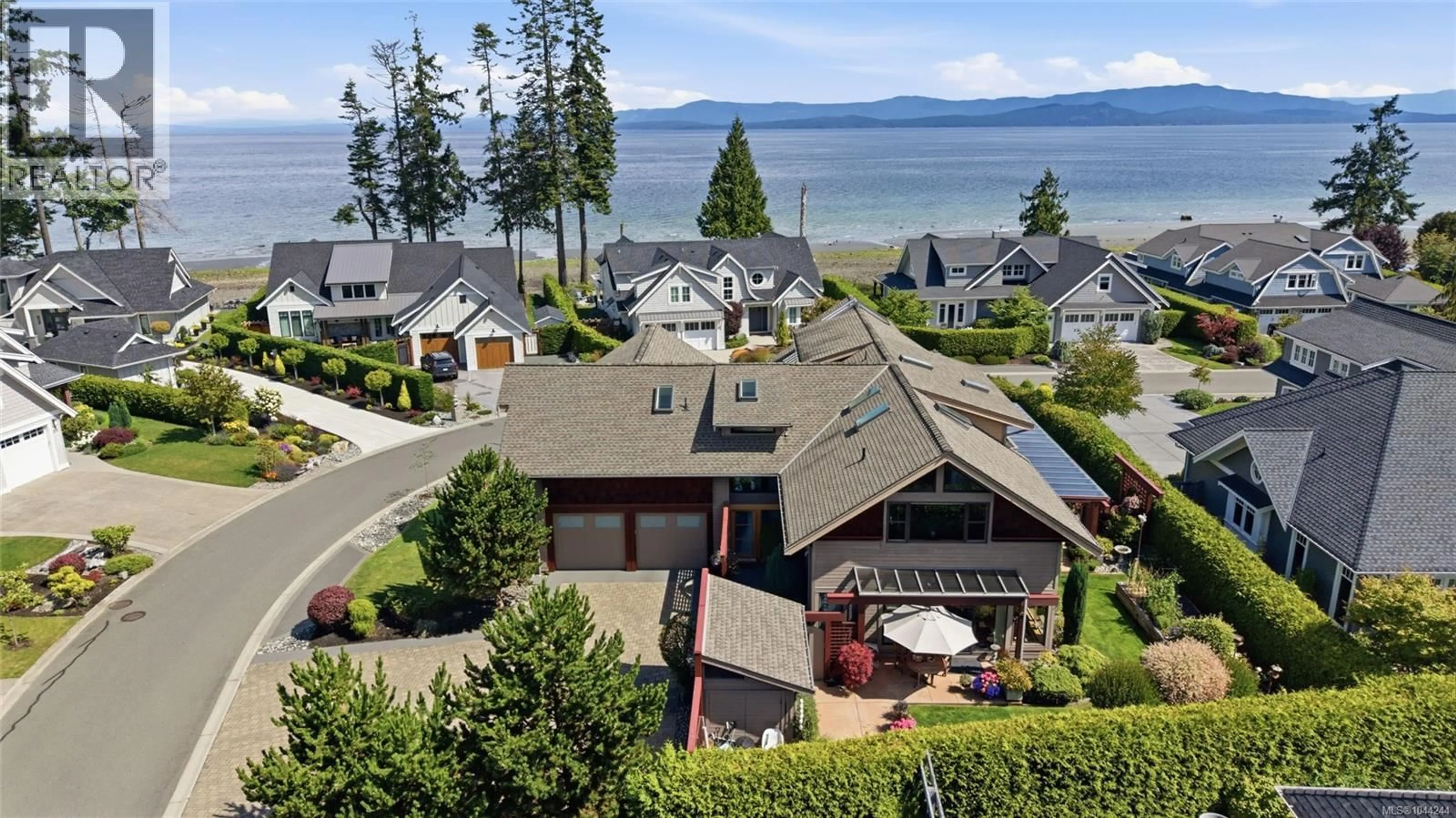 A pic from outside/outdoor area/front of a property/back of a property/a pic from drone, water/lake/river/ocean view for 880 BLUFFS DRIVE, Qualicum Beach British Columbia V9K0A2
