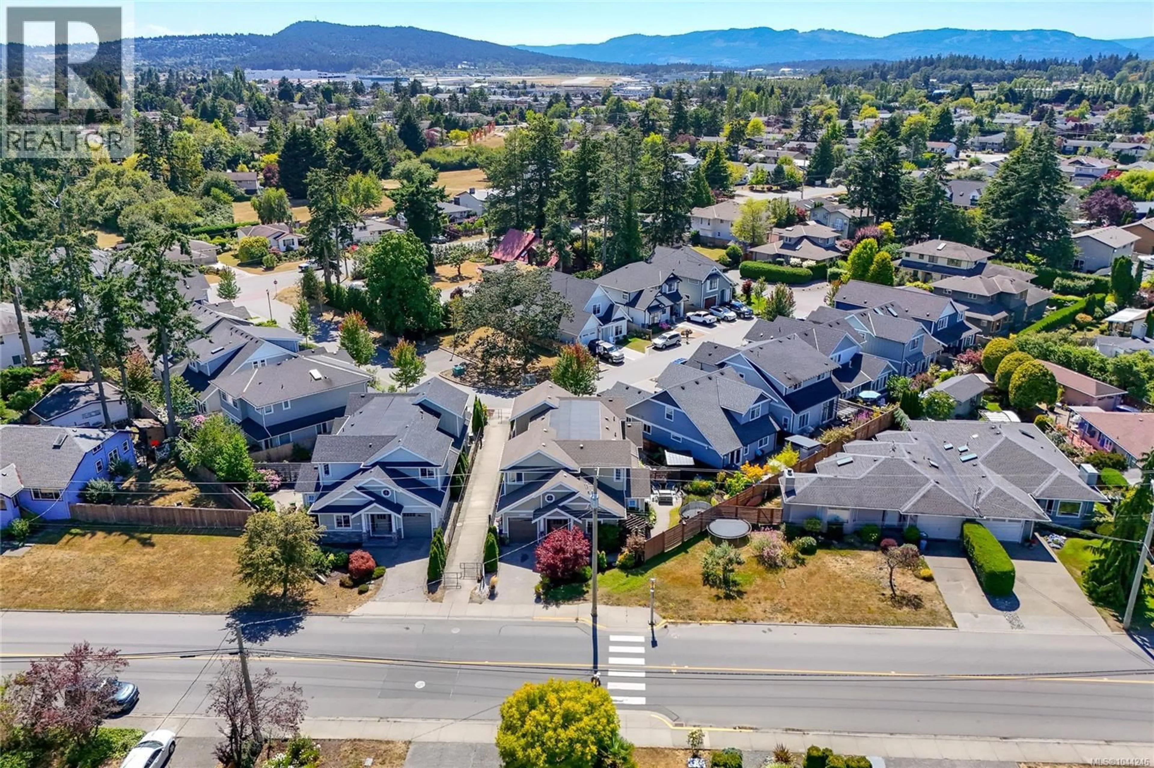 A pic from outside/outdoor area/front of a property/back of a property/a pic from drone, mountain view for 10372 RESTHAVEN DRIVE, Sidney British Columbia V8L3H3