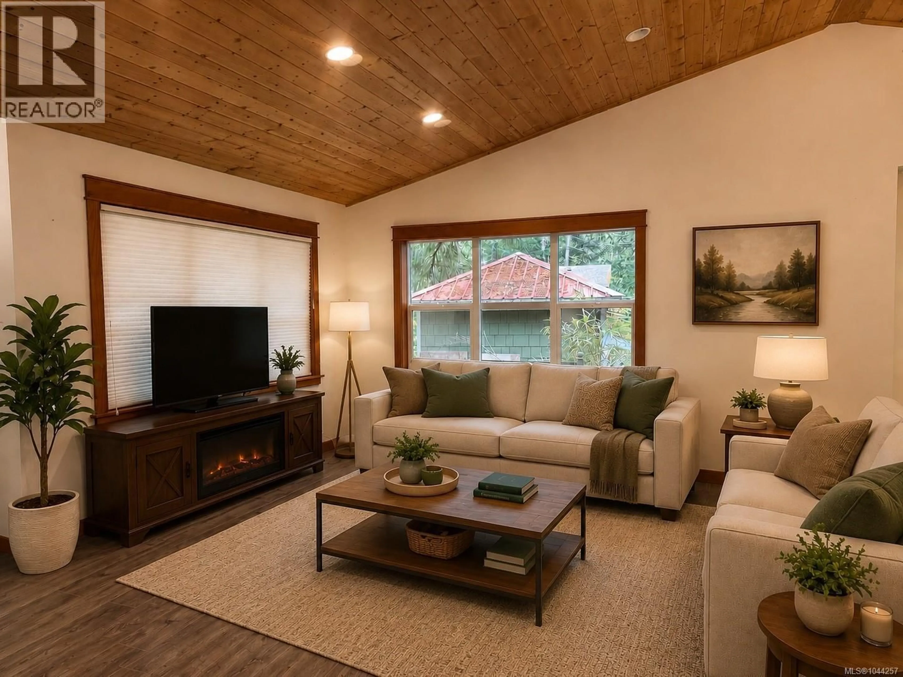 Living room with furniture, wood/laminate floor for 685 ROLLO ROAD, Gabriola Island British Columbia V0R1X3