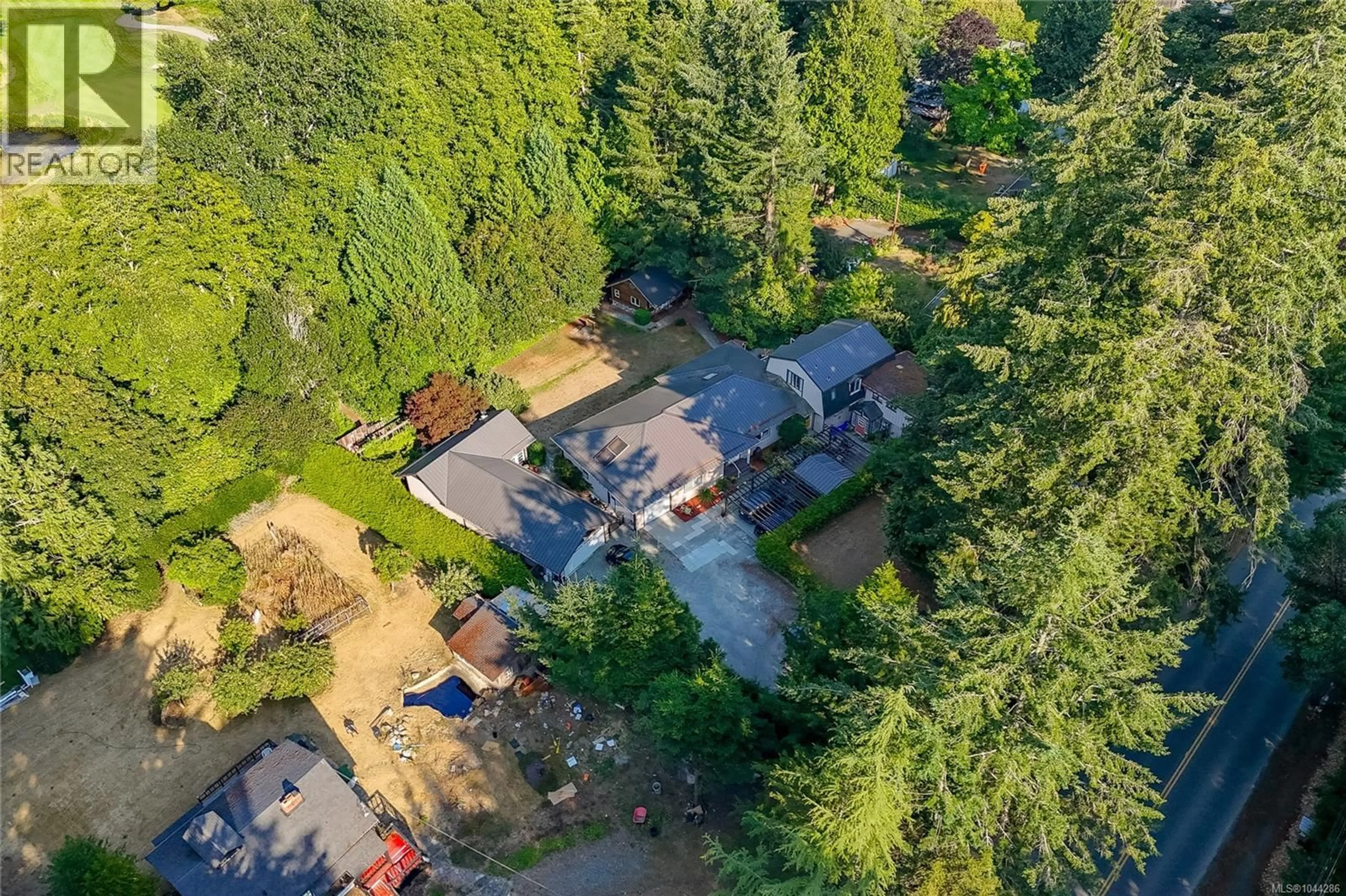 A pic from outside/outdoor area/front of a property/back of a property/a pic from drone, forest/trees view for 5435 FOWLER ROAD, Saanich British Columbia V8Y1Y4