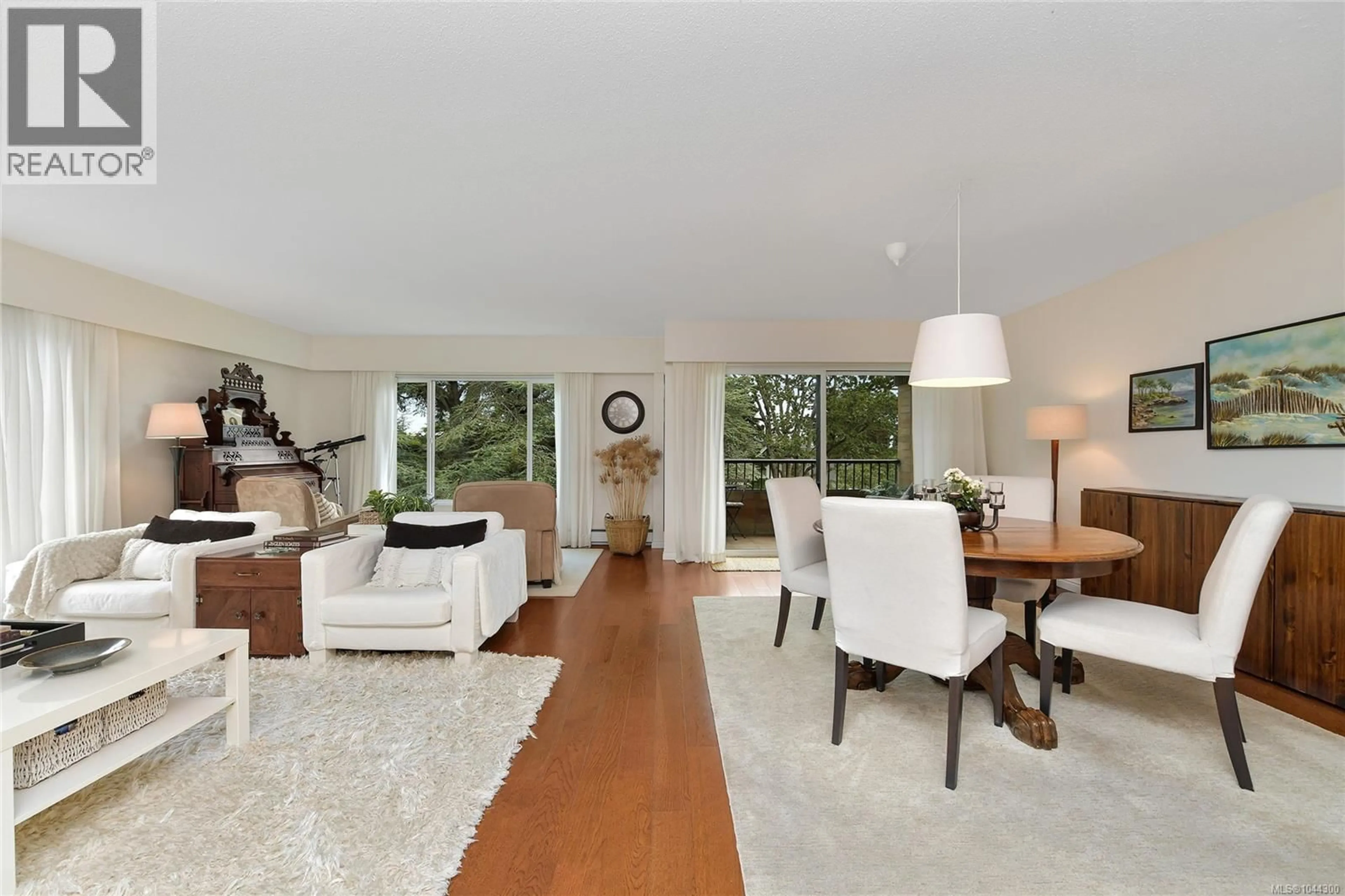 Living room with furniture, wood/laminate floor for 305 - 2930 COOK STREET, Victoria British Columbia V8W3G3